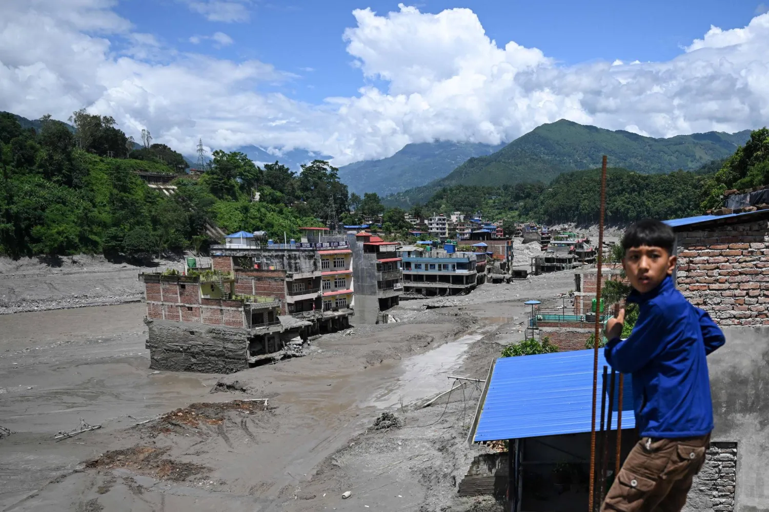 A general view shows houses lying deluged in sludge after flash floods at Trishuli in Nepal's Nuwakot district on August 27, 2026. (AFP)