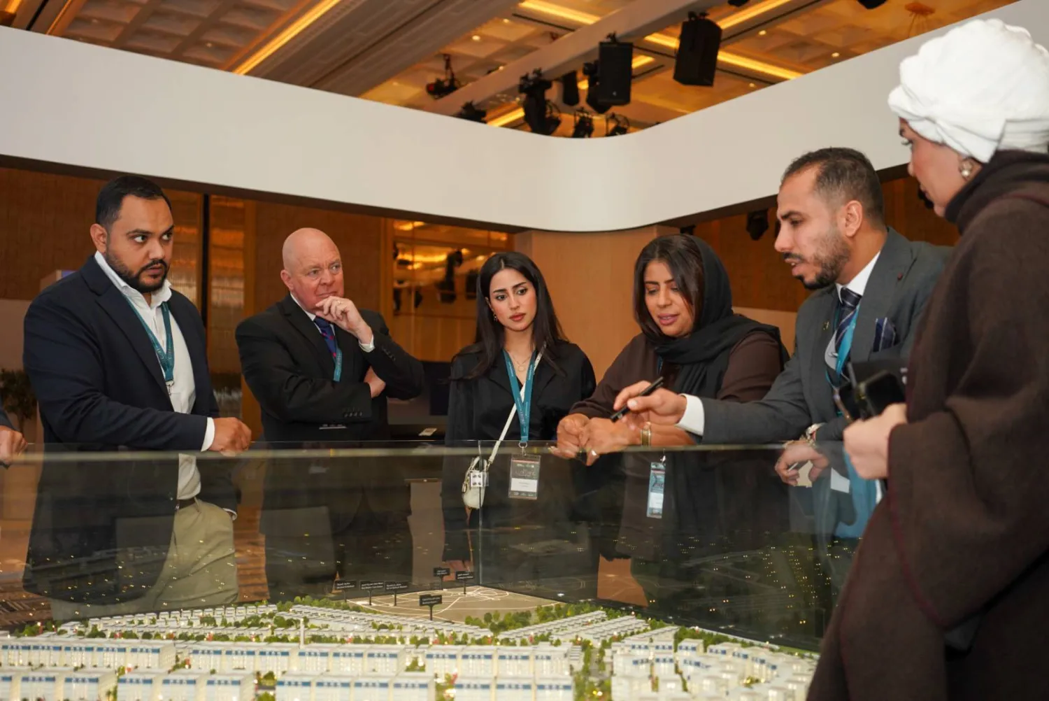 Participants at the Saudi Luxury Real Estate Exhibition in London listen to a presentation on one of the projects (Asharq Al-Awsat)