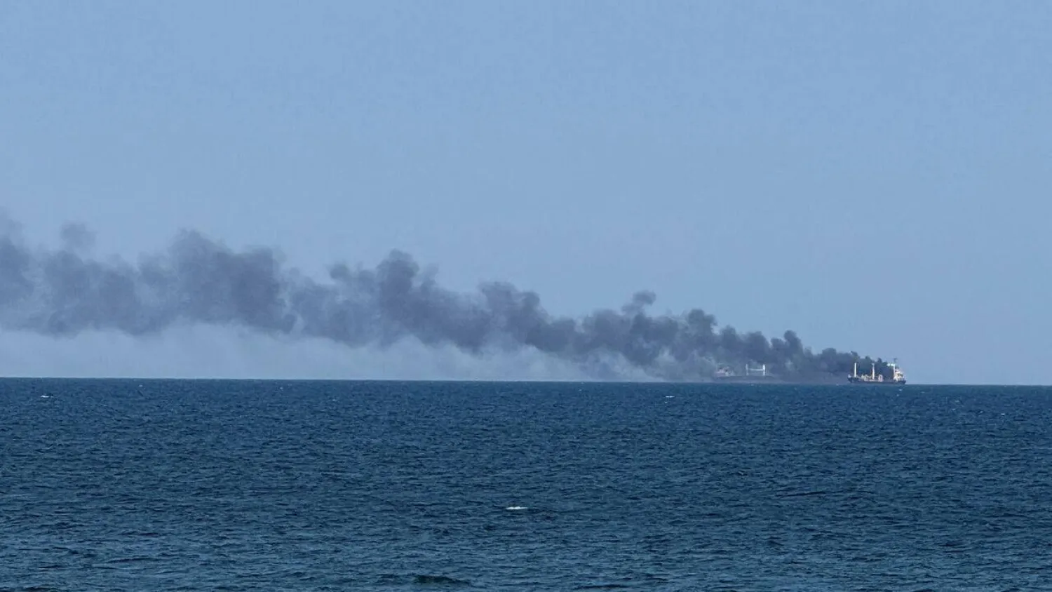 Smoke rises from a civilian vessel on fire, amid Russia's attack on Ukraine, in Odesa, Ukraine July 19, 2026. (Reuters) 
