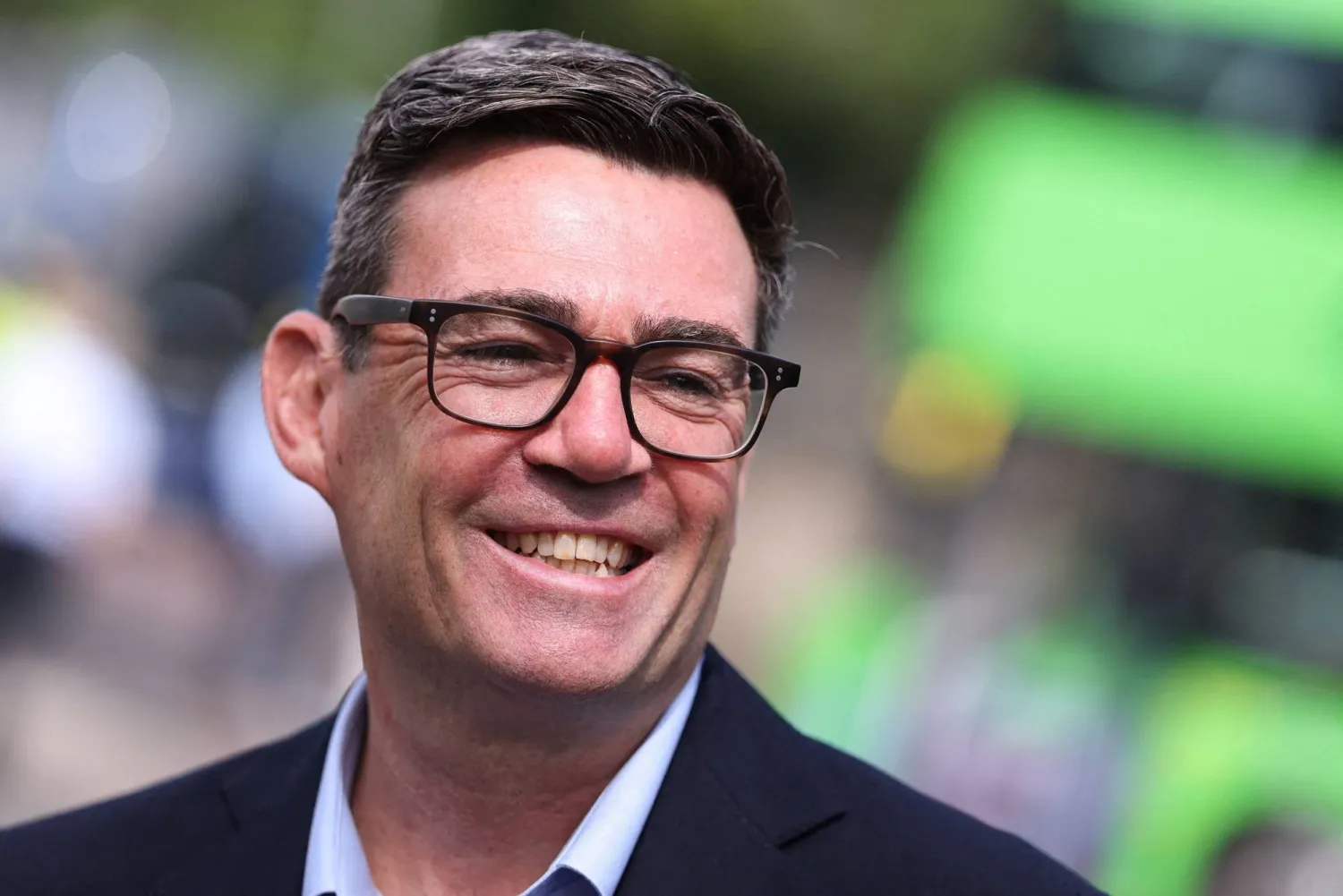 Britain's Prime Minister Andy Burnham smiles during a visit to Bath, western England, on July 22, 2026. (AFP)