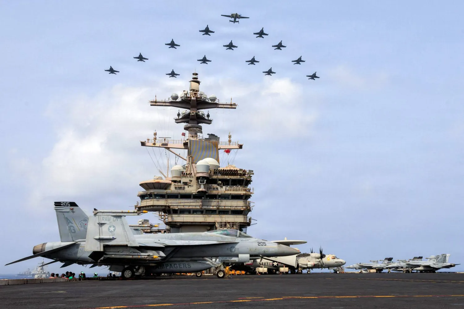 This US Navy handout photo released on July 15, 2026 and taken on June 30 by US Central Command Public Affairs shows the Carrier Air Wing (CVW) 7 flying in formation over the USS George H.W. Bush (CVN 77) in the Arabian Sea. (AFP / US Central Command Public Affairs)