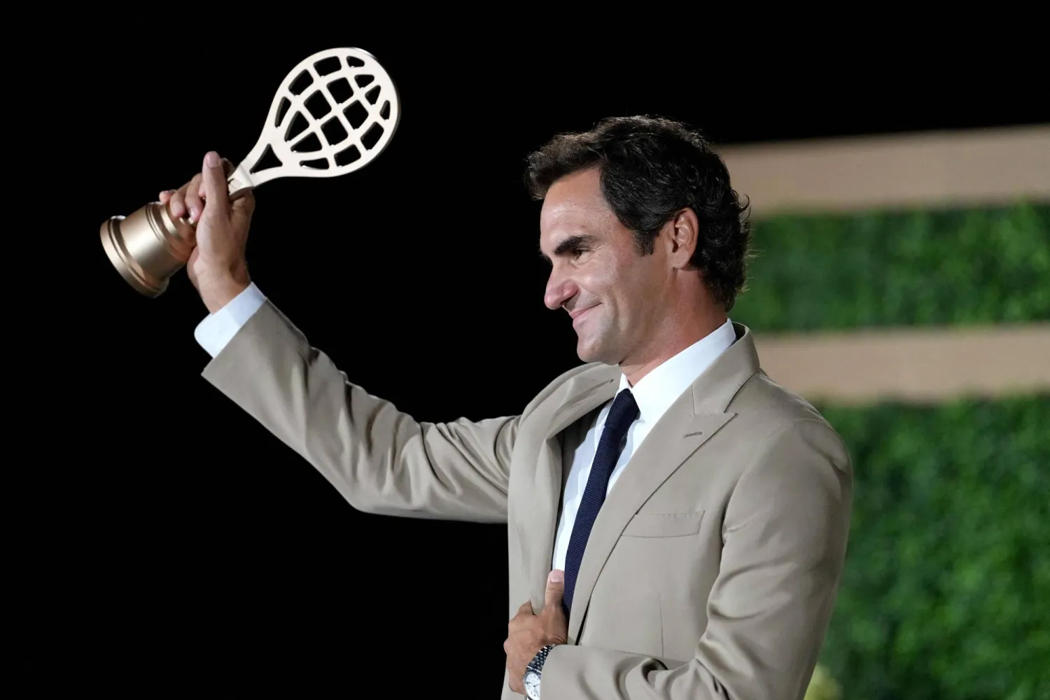 Inductee Roger Federer poses for a photo with his golden racquet following the International Tennis Hall of Fame 2026 Induction Ceremony on August 29, 2026 in Newport, Rhode Island. (Getty Images/AFP)