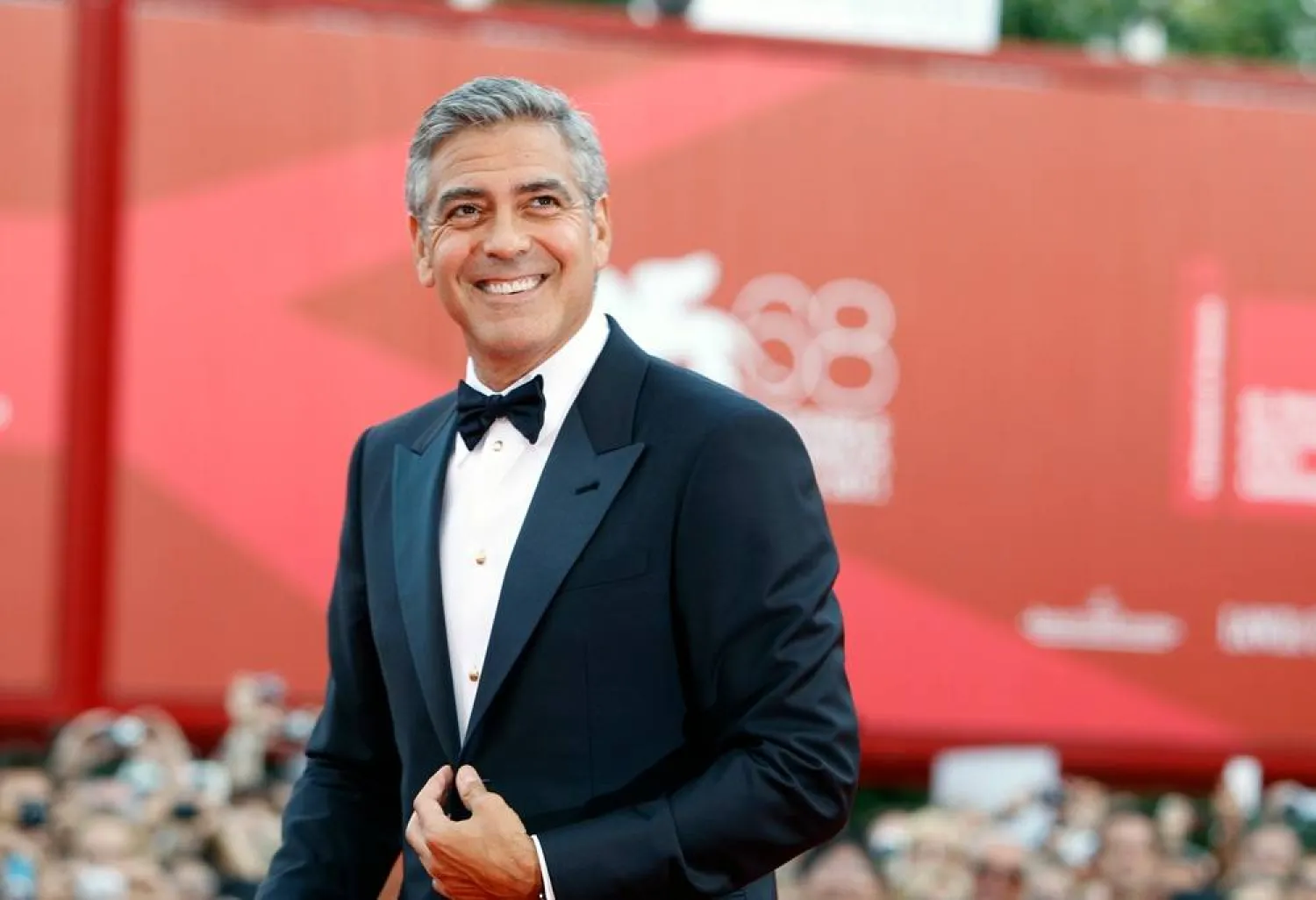 George Clooney poses on the red carpet at the premiere of his film "The Ides of March," opening the 68th edition of the Venice Film Festival in Venice, Italy on Aug. 31, 2011. (AP)