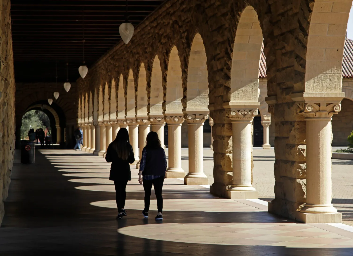 Students walk through the Stanford University campus, March 14, 2019, in Santa Clara, Calif. (AP)