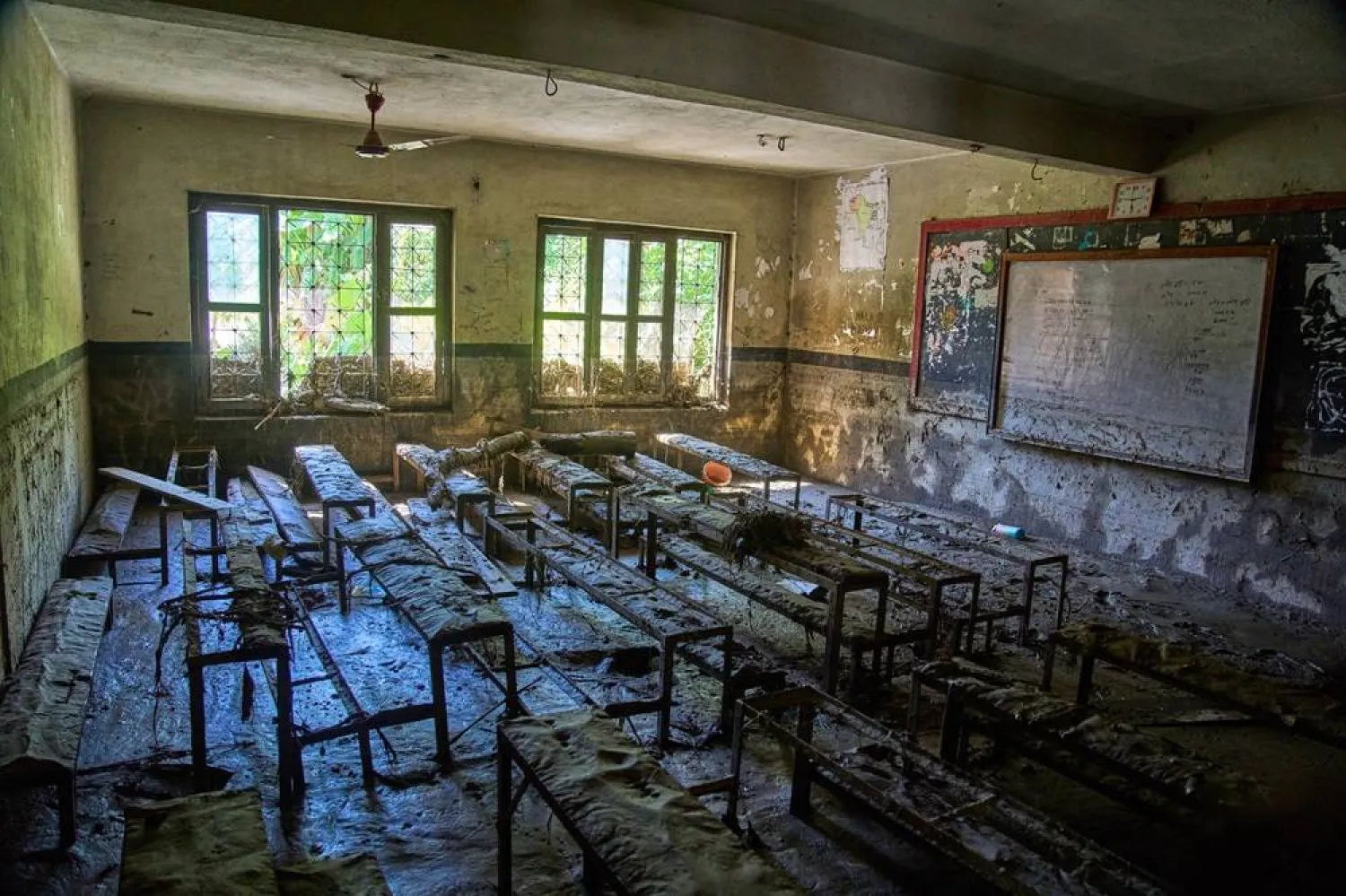  Mud covers the floor of a classroom damaged in the recent flash floods at the Shree Bagheswori Madhyamik School in Galchhi, Dhading district of Nepal Sunday, Aug. 30, 2026. (AP) 