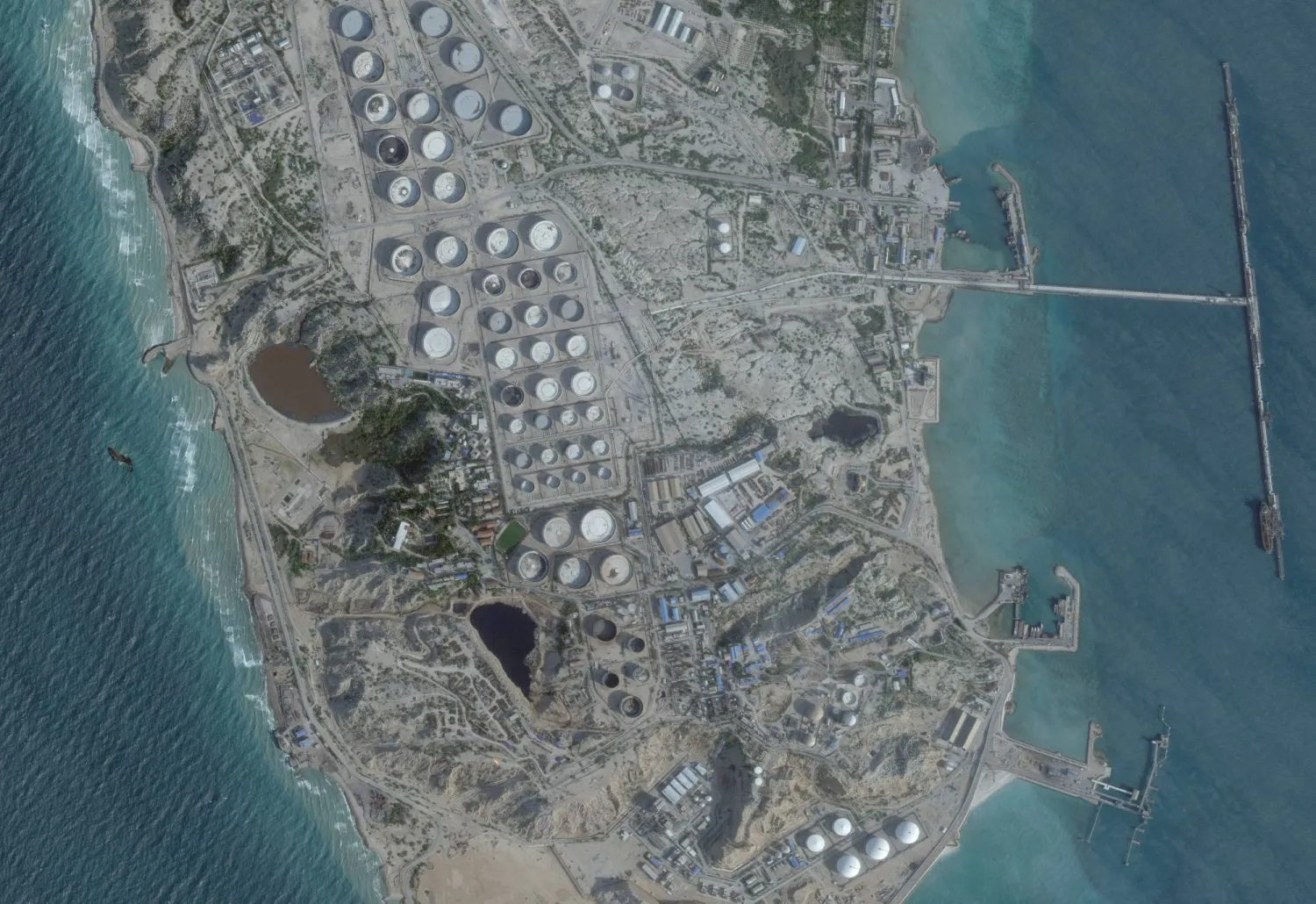 FILE PHOTO: A satellite image shows an oil terminal at Kharg Island, Iran, February 25, 2026. 2026 Planet Labs PBC/Handout via REUTERS