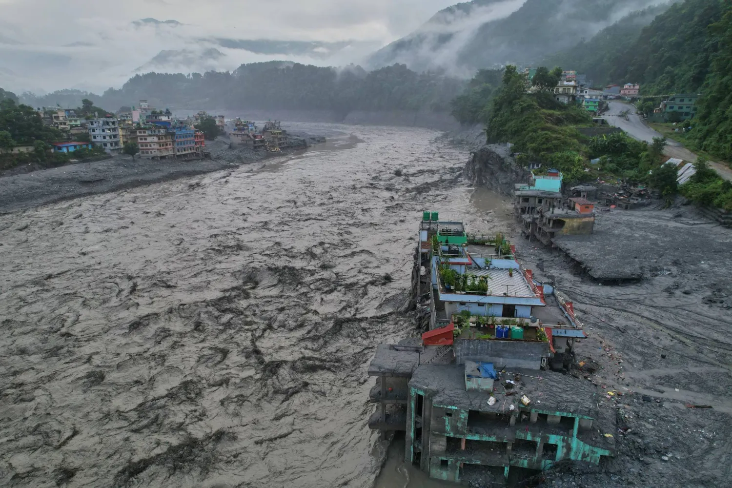 A drone view of the aftermath of flash flooding along the Trishuli river amidst fresh water surge warning in the Trishuli Bazaar area of Nuwakot district, Nepal, Sunday, Aug. 30, 2026. (AP) 