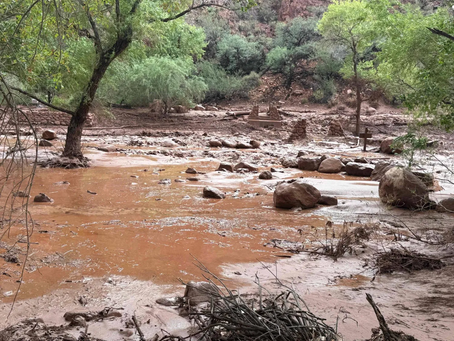 This handout image released by the Grand Canyon National Park Service via X on August 30, 2026 shows remnants of stone bridge pylons along Bright Angel Creek following a flash flood that destroyed the footbridge on August 29. (AFP/ National Park Service) 