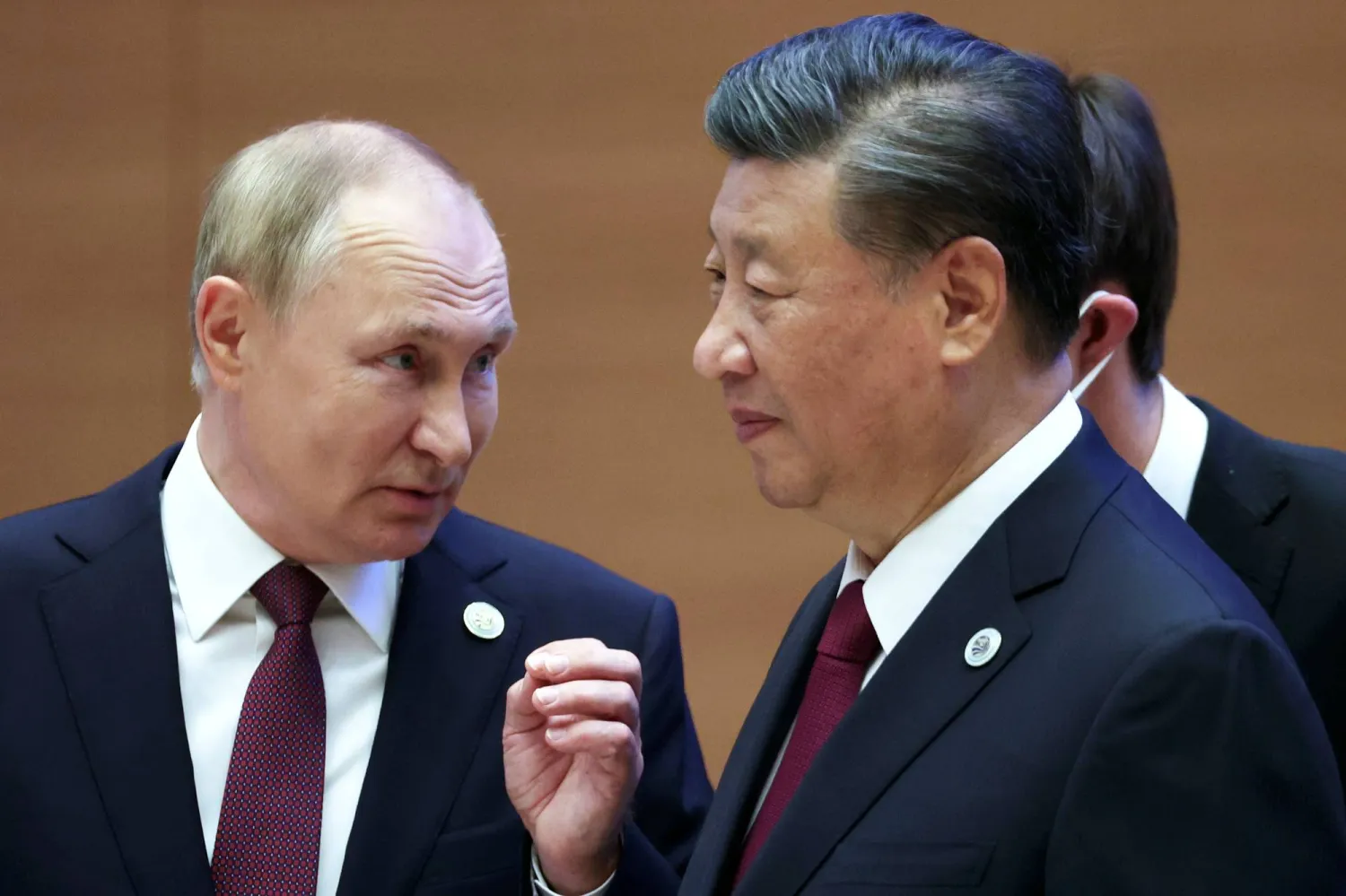 FILE - Russian President Vladimir Putin, left, gestures while speaking to Chinese President Xi Jinping during the Shanghai Cooperation Organization (SCO) summit in Samarkand, Uzbekistan, Sept. 16, 2022. (Sergei Bobylev, Sputnik, Kremlin Pool Photo via AP, File)