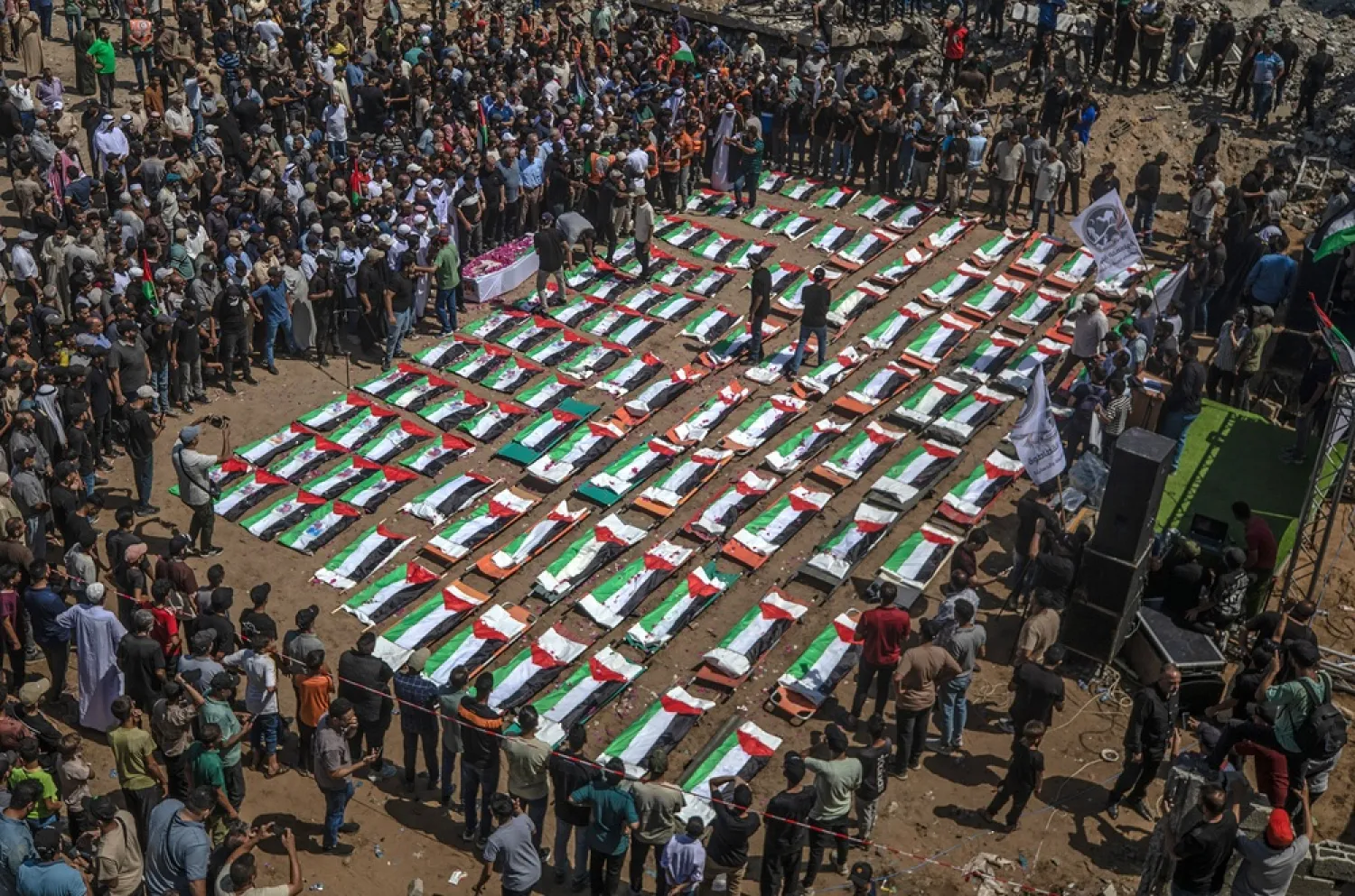 Palestinians gather during a mass funeral for 112 members of the Abu Sharia and Al-Hassayna families in the eastern Gaza City, 04 August 2026. (EPA) 