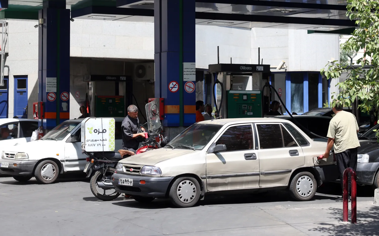 An Iranian fills up at a petrol station in Tehran, Iran, 25 August 2026. (EPA)