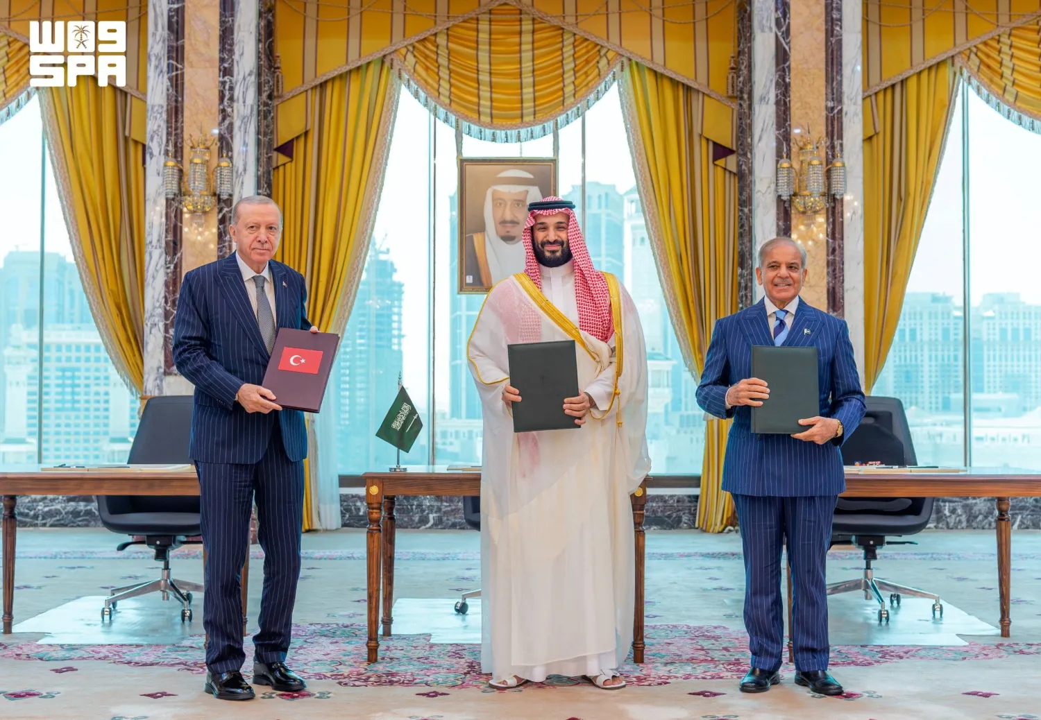 Turkish President Recep Tayyip Erdogan, Prince Mohammed bin Salman, Saudi Crown Prince and Prime Minister, and Pakistan's Prime Minister Shehbaz Sharif pose after signing a joint defense agreement in Makkah, Saudi Arabia, August 7, 2026. (SPA) 