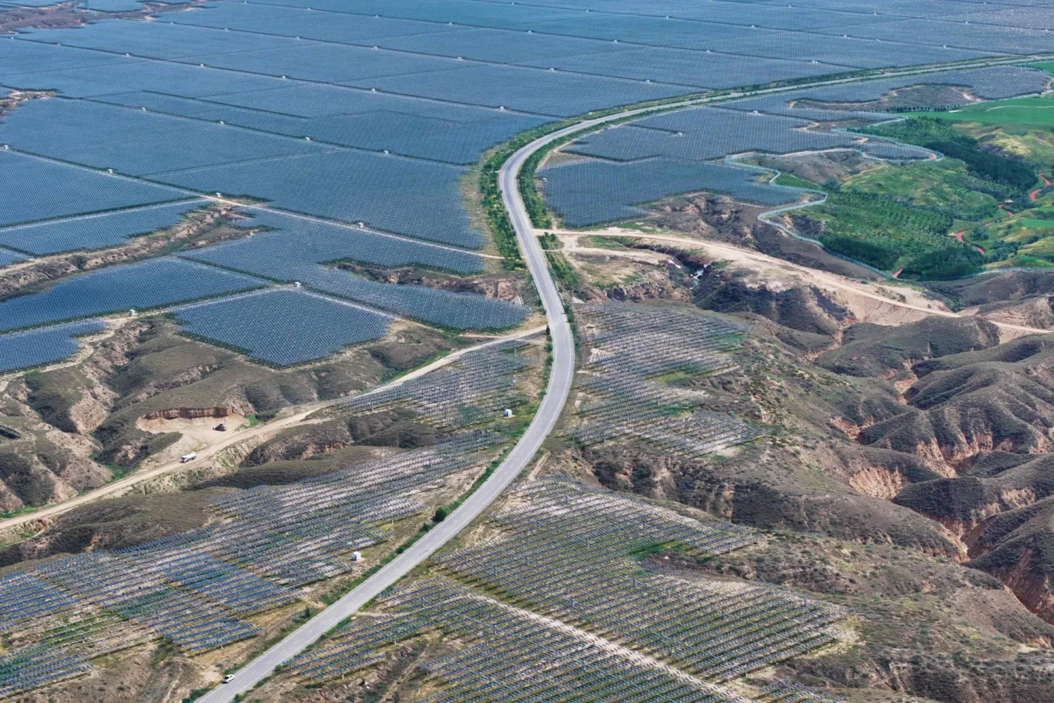  An aerial view of solar panels at the Yinchuan Fourth Photovoltaic Power Station in Yinchuan, in northwestern China's Ningxia Hui Autonomous Region, on August 25, 2026. (CN-STR / AFP) 