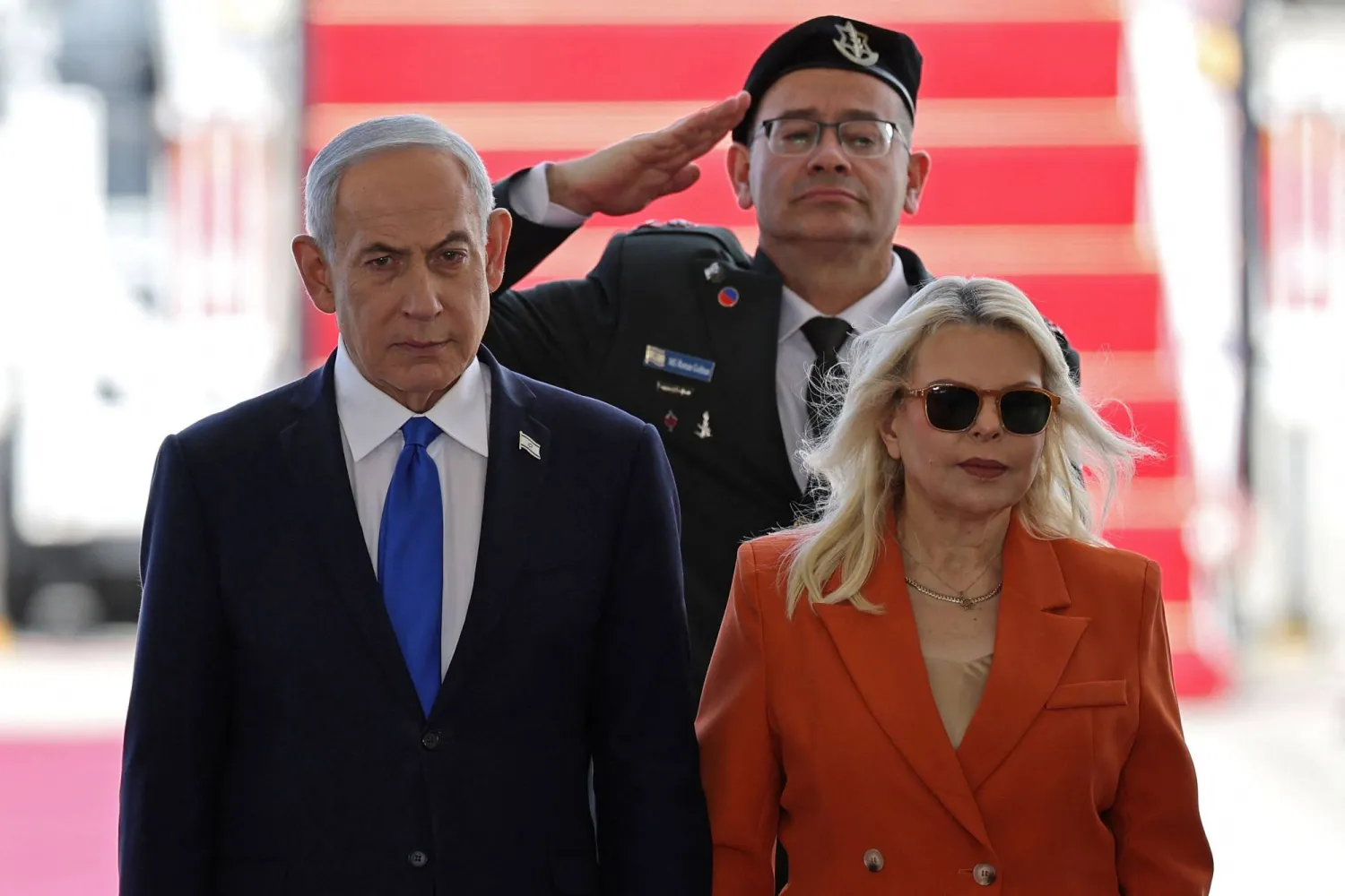 Israel's Prime Minister Benjamin Netanyahu (L) and his wife Sara Netanyahu stand during a welcome ceremony for India's Prime Minister Narendra Modi at the Ben Gurion airport near Tel Aviv on February 25, 2026. (AFP)