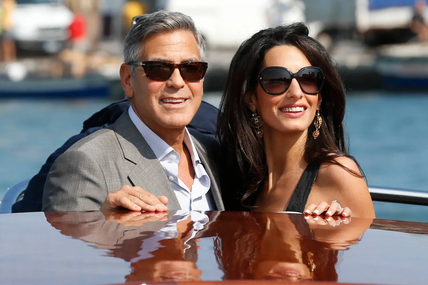 George Clooney, left, and Amal Alamuddin arrive in Venice, Italy, on Sept. 26, 2014, for their wedding. (AP)