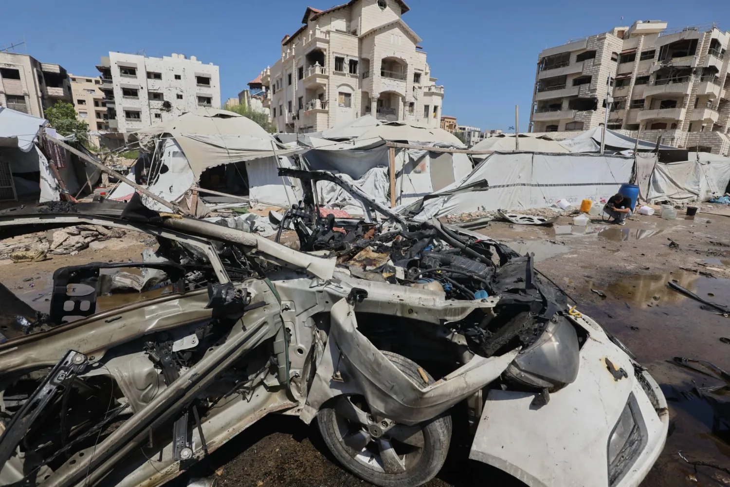 A destroyed vehicle is seen on a street following an Israeli military strike in Gaza City, Tuesday, Sept. 1, 2026. (AP)
