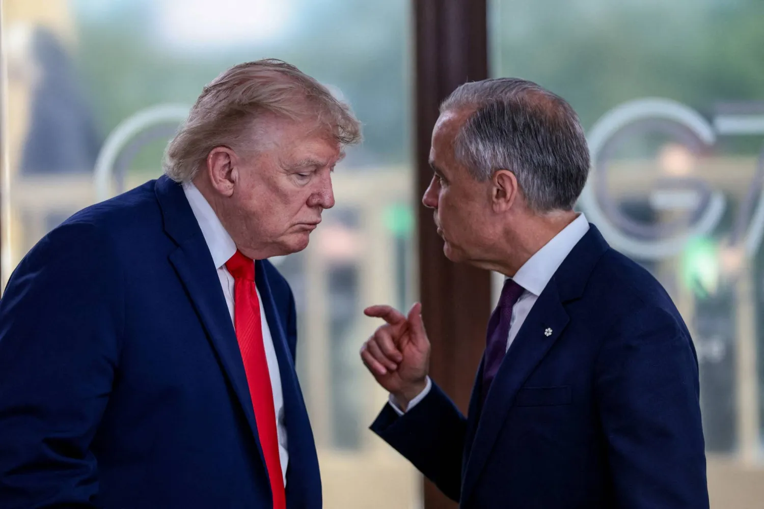 US President Donald Trump speaks with Canadian Prime Minister Mark Carney at a working lunch with leaders of G7 and the Middle East, in Evian-les-Bains, France, June 16, 2026. (Reuters)