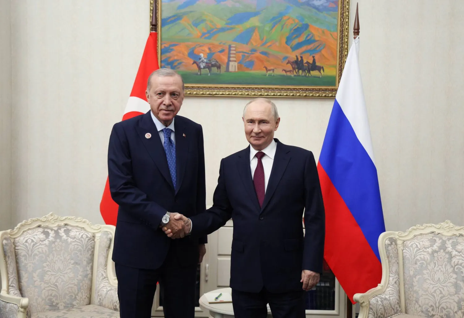 Turkish President Recep Tayyip Erdogan (L) and Russian President Vladimir Putin shake hands during a meeting on the sidelines of the Shanghai Cooperation Organization (SCO) summit in Bishkek, Kyrgyzstan, 01 September 2026. (EPA/Vyacheslav Prokofyev / Sputnik / Kremlin Pool)