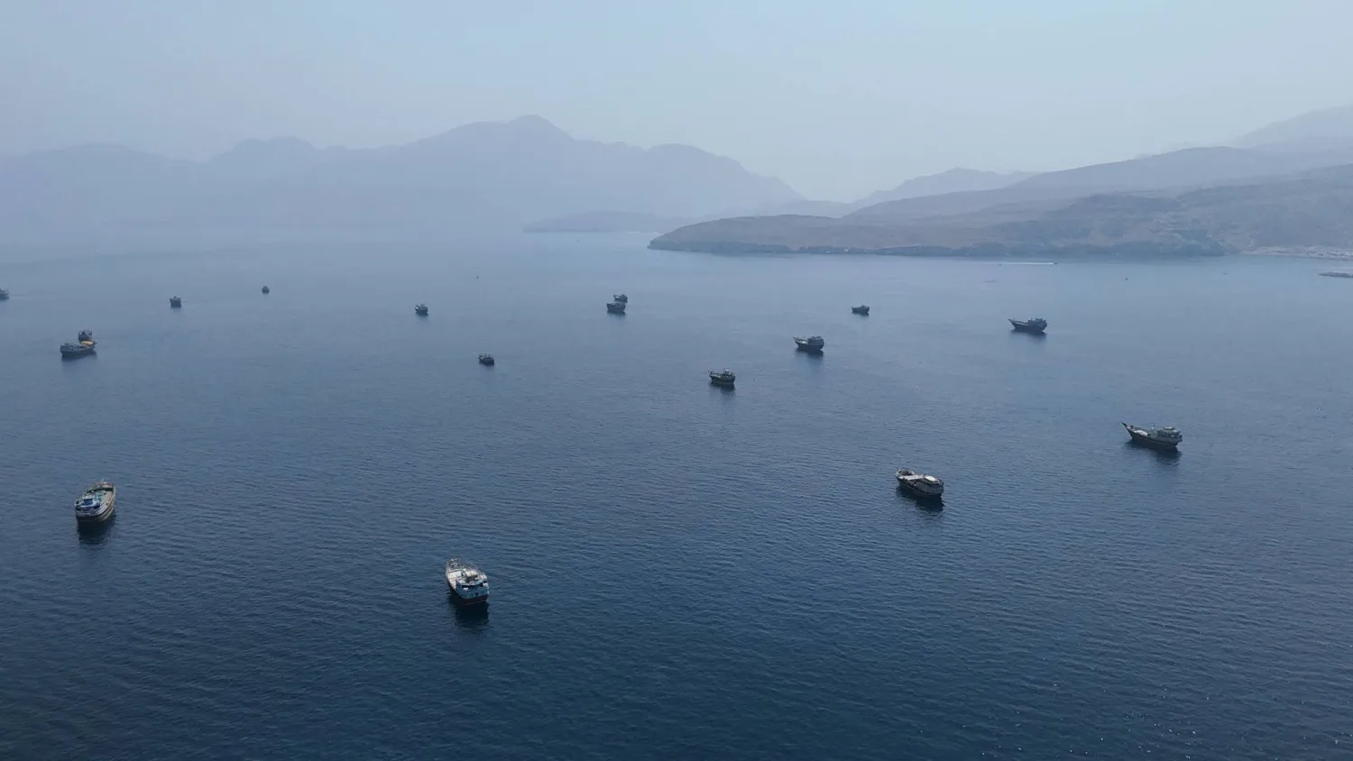 A drone view shows vessels near the Strait of Hormuz, as seen from Musandam, Oman, August 28, 2026. (Reuters)