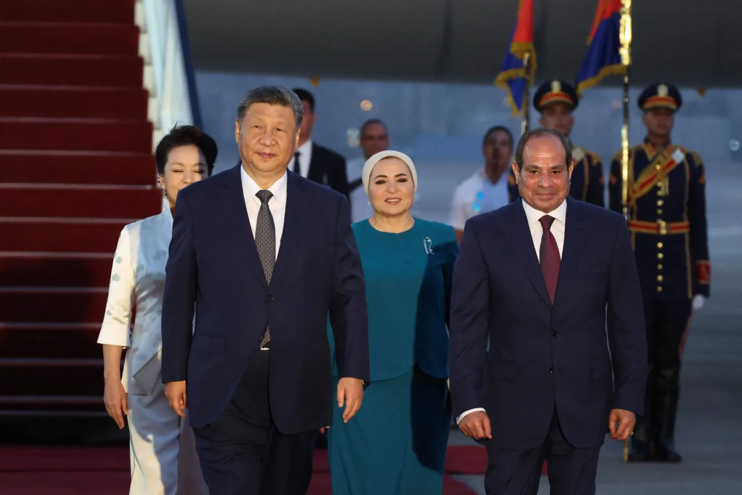 Chinese President Xi Jinping, with his wife First Lady Peng Liyuan, is welcomed by Egyptian President Abdel Fattah al-Sisi and his wife First Lady Entissar Amer upon their arrival at Cairo International Airport for an official visit to Egypt, which is his first state visit to the country in 10 years, in Cairo on September 1, 2026. (AFP)