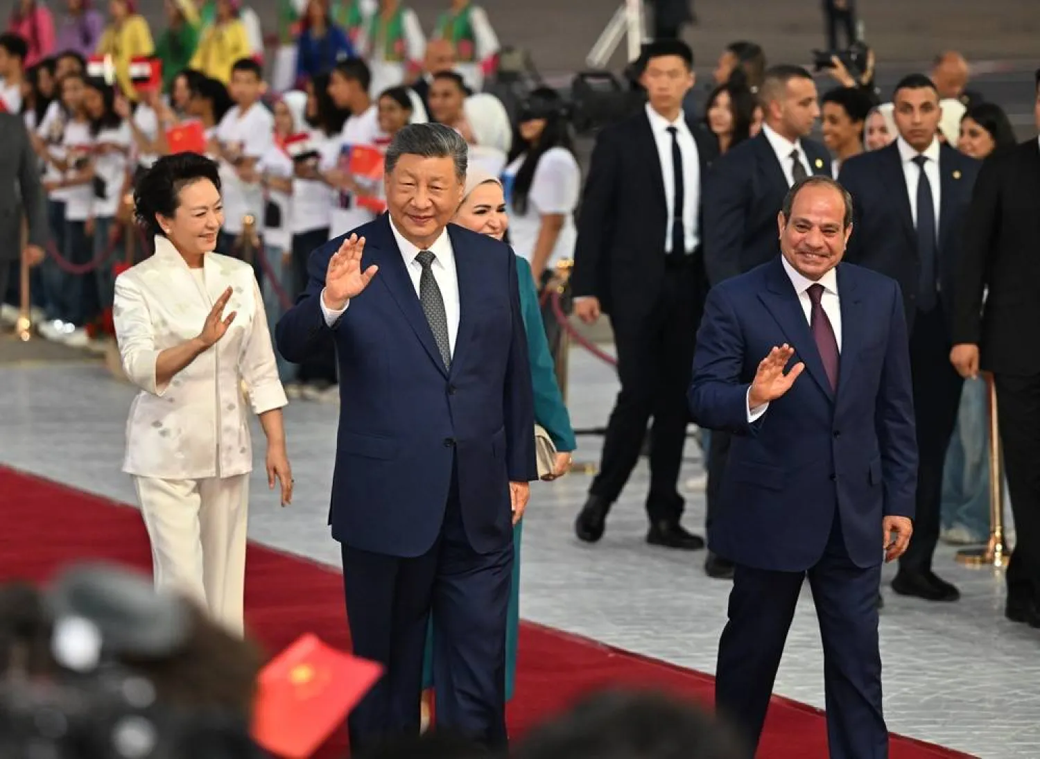  In this photo released by Xinhua News Agency, Chinese President Xi Jinping, second left, and his wife Peng Liyuan, left, are welcomed by Egyptian President Abdel Fattah al-Sisi, right, and his wife Entissar Amerupon on their arrival at Cairo International Airport in Cairo, Tuesday, Sept. 1, 2026. (Yin Bogu/Xinhua via AP) 
