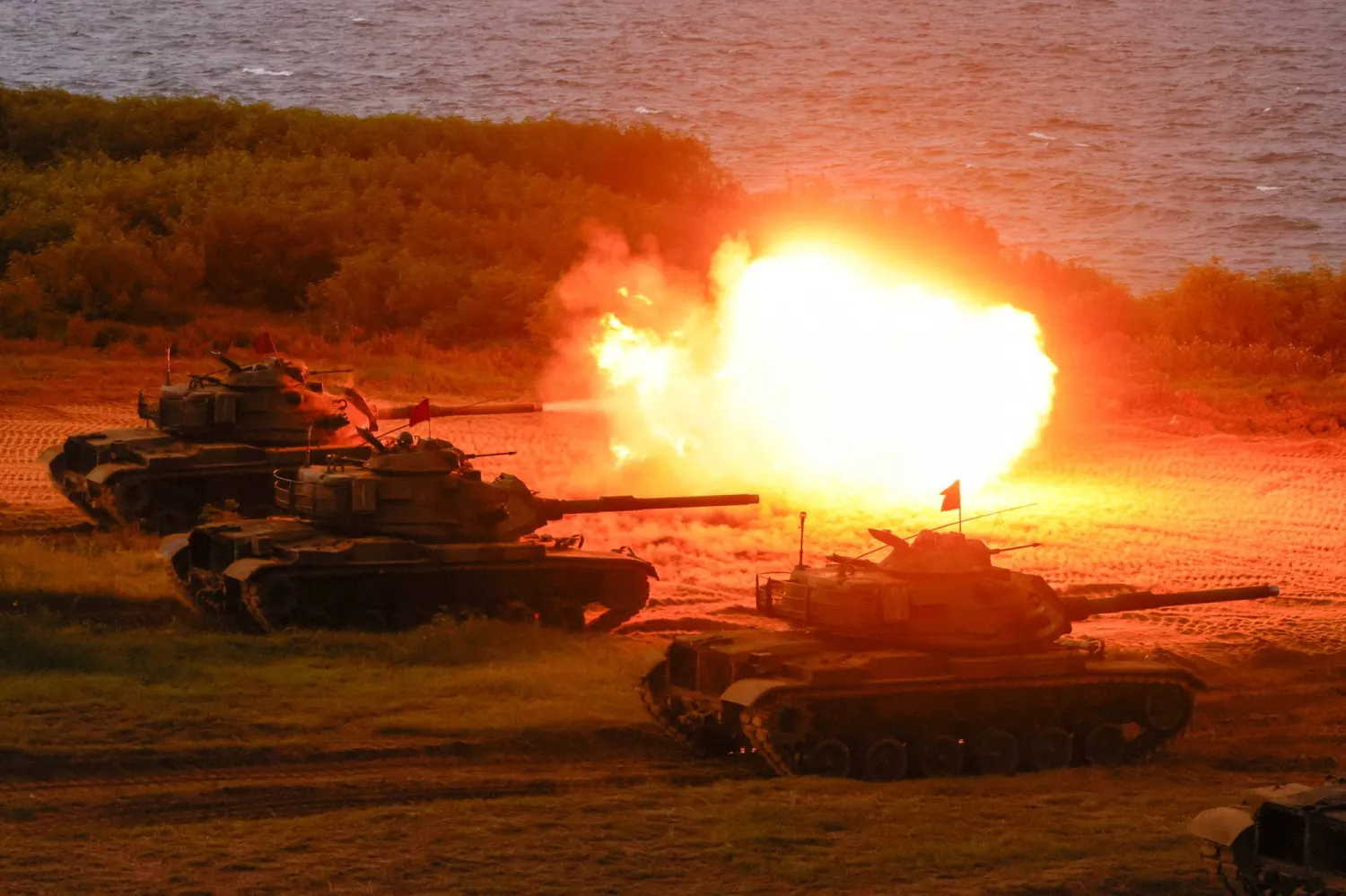 M60A3 tanks fire during a live-fire drill as part of the Han Kuang military exercise in Penghu, Taiwan, August 10, 2026. (Reuters)