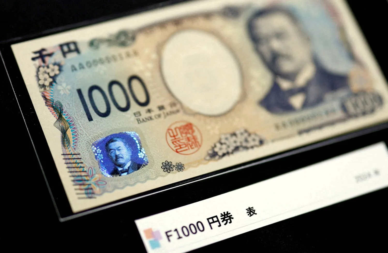 ورقة نقدية من فئة 1000 ين ياباني (رويترز)