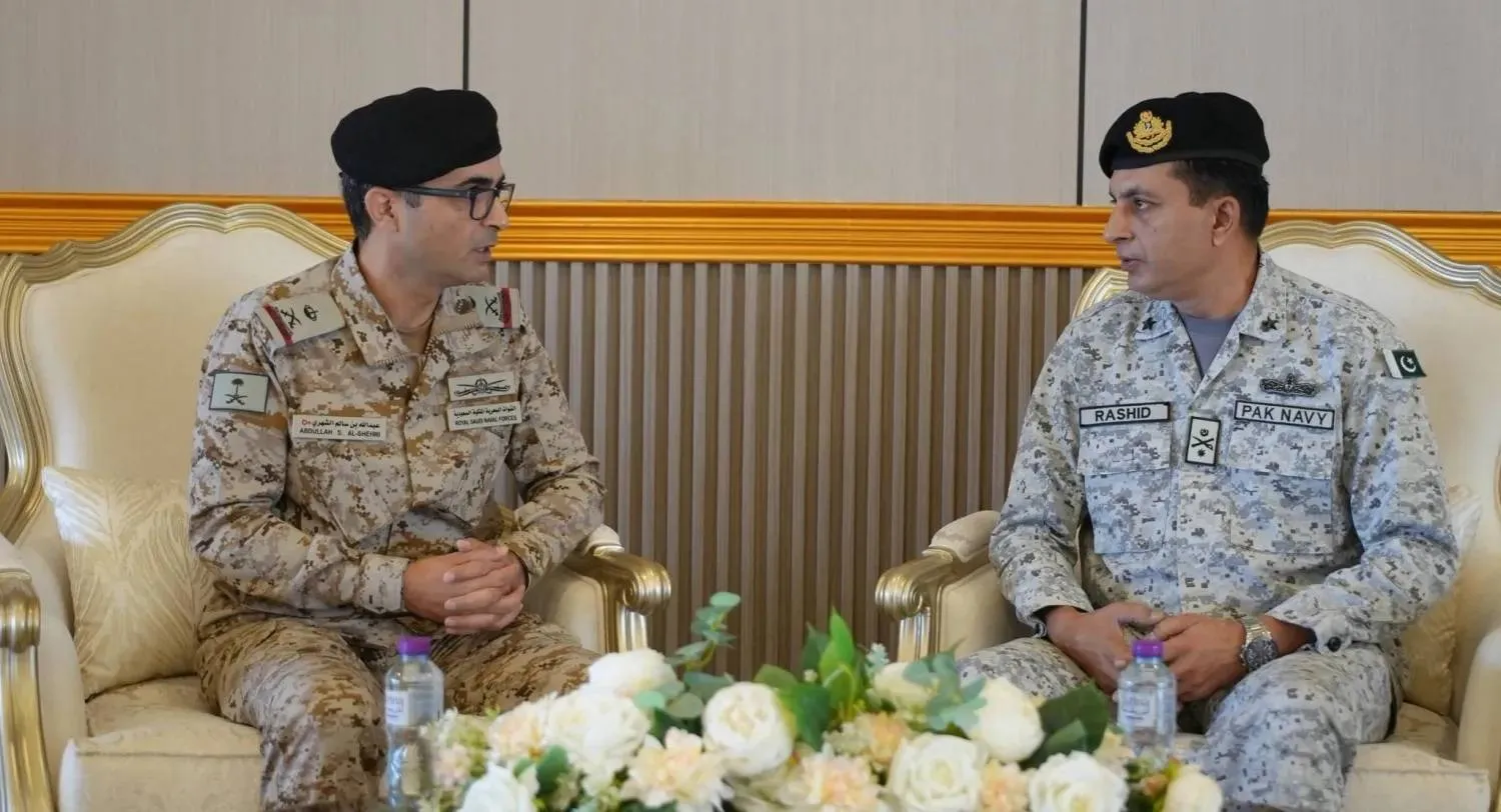 Coalition commander Rear Admiral Abdullah Al-Shehri receives his deputy, Commodore Rashid Sheikh, at the command headquarters. (Saudi Defense Ministry) 