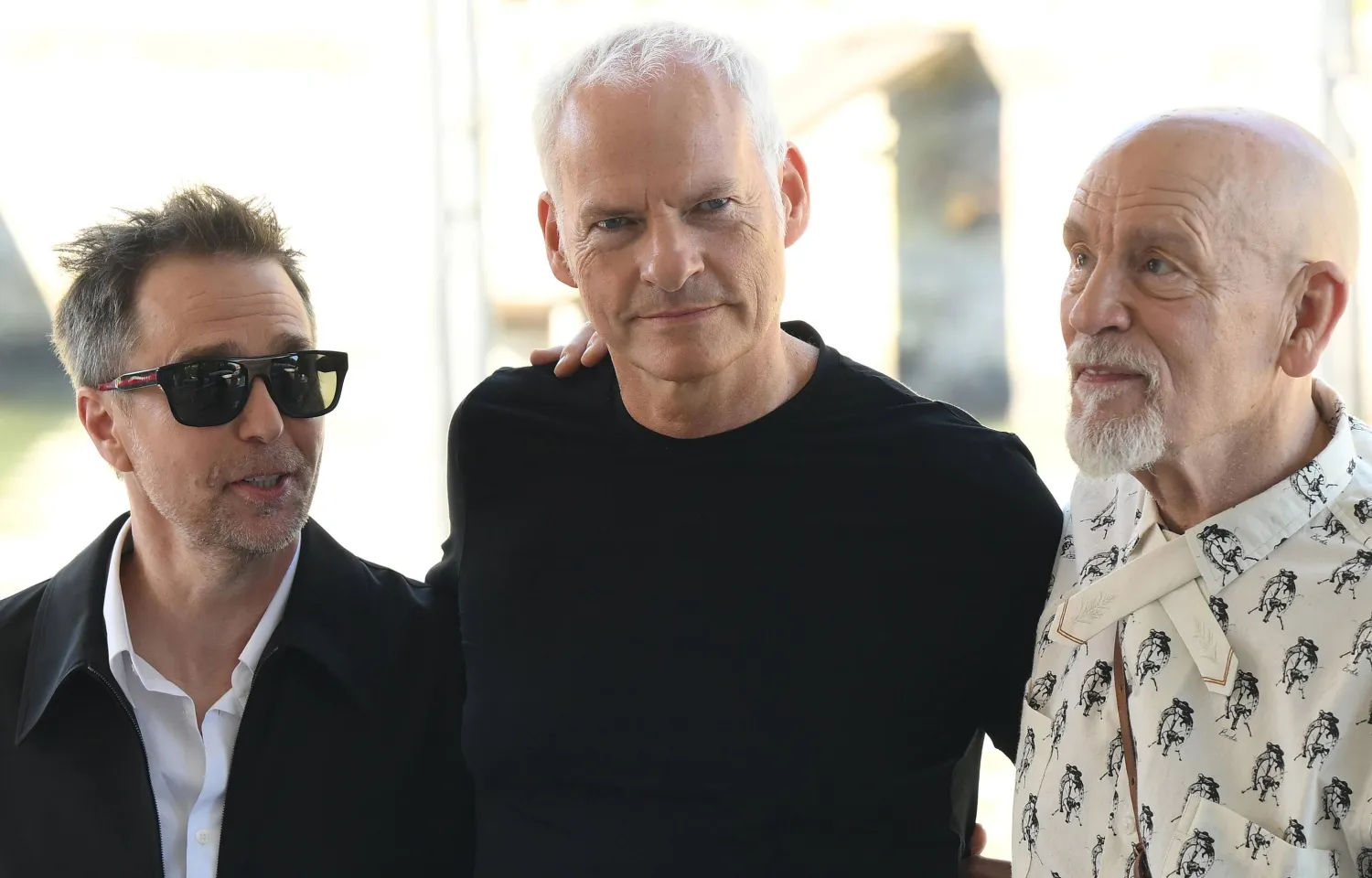 Actors John Malkovich (R) and Sam Rockwell (L) with director Martin McDonagh (C) arrive at the Lido Beach for the Venice International Film Festival, in Venice, Italy, 03 September 2026. (EPA)