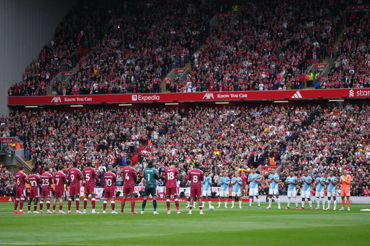Liverpool and Nottingham Forest players observe a minute applause for Kevin Keegan the English Premier League soccer match between Liverpool and Nottingham Forest in Liverpool, England, Saturday, Aug. 29, 2026. (AP Photo/Jon Super)