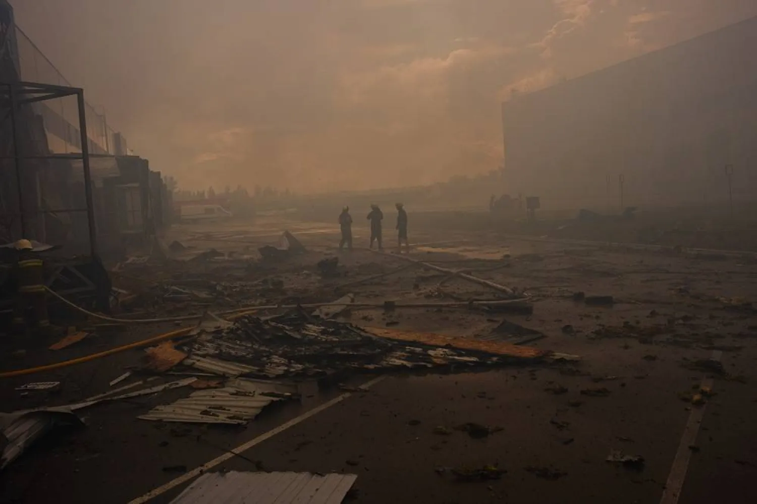 Firefighters walk among debris at a destroyed pharmaceutical warehouse after Russian drone attacks on the outskirts of Kyiv, Ukraine, Thursday, Sept. 3, 2026. (AP)