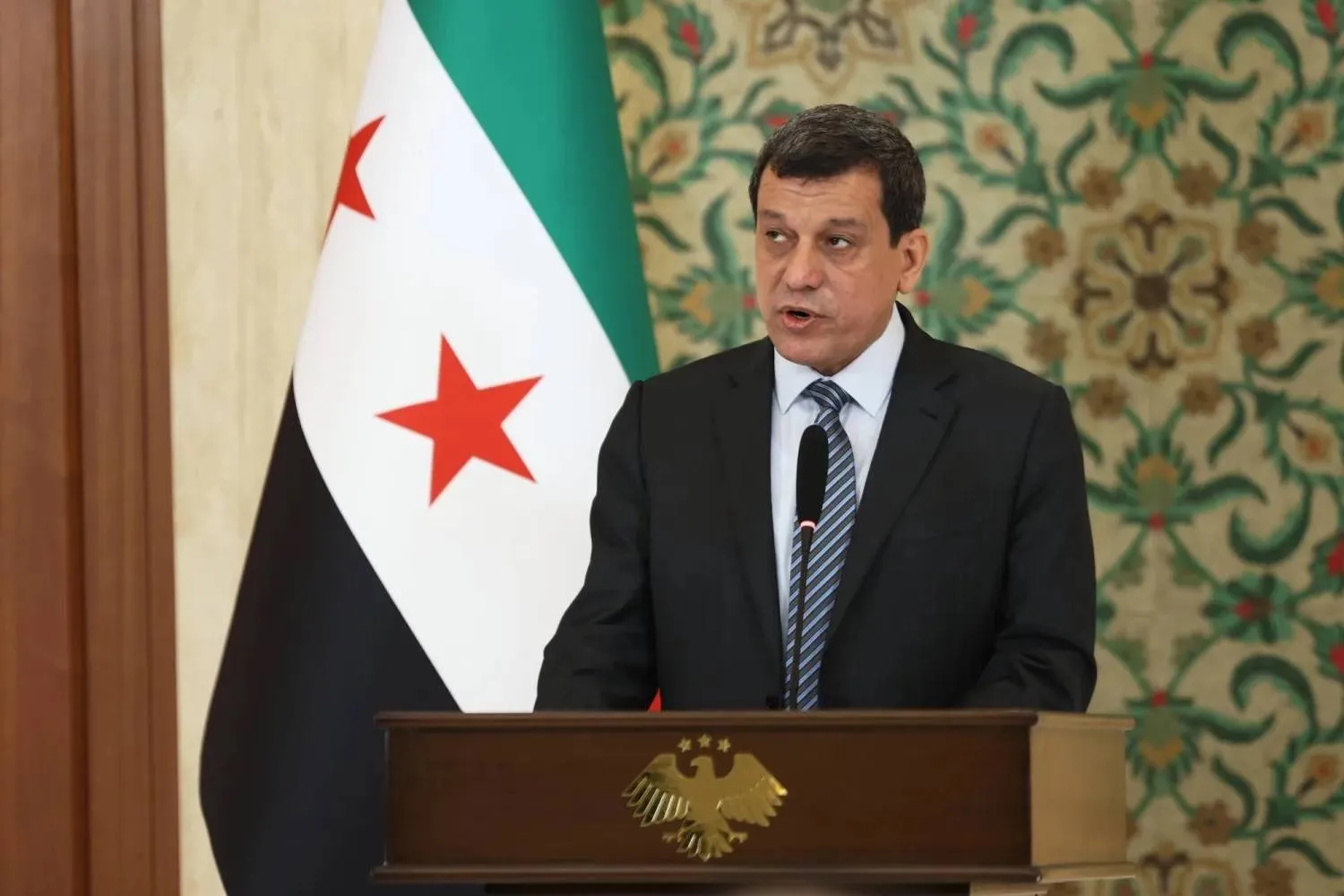 This photo taken on August 25, 2026 shows Syrian presidential adviser Mustafa “Mazloum” Abdi speaking during a televised speech at the People's Palace in Damascus. (AFP) 