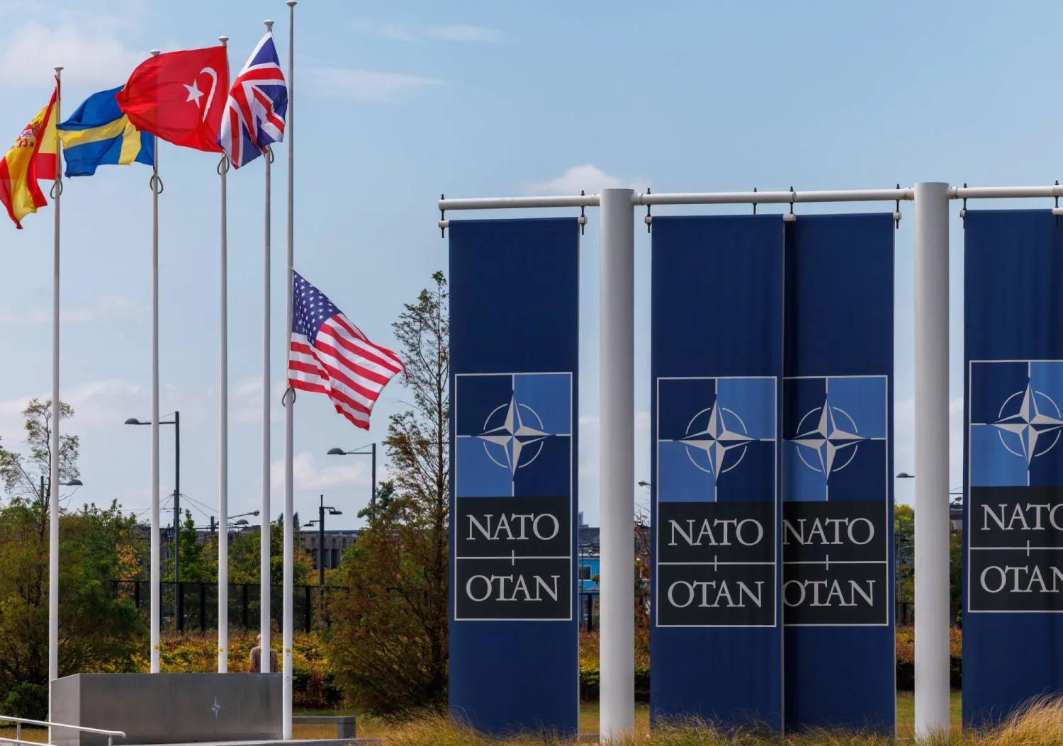 The US flag is lowered to half staff to honor country music legend Dolly Parton following her passing, at the North Atlantic Treaty Organization (NATO) headquarters, in Brussels, Belgium, 27 August 2026. (EPA)