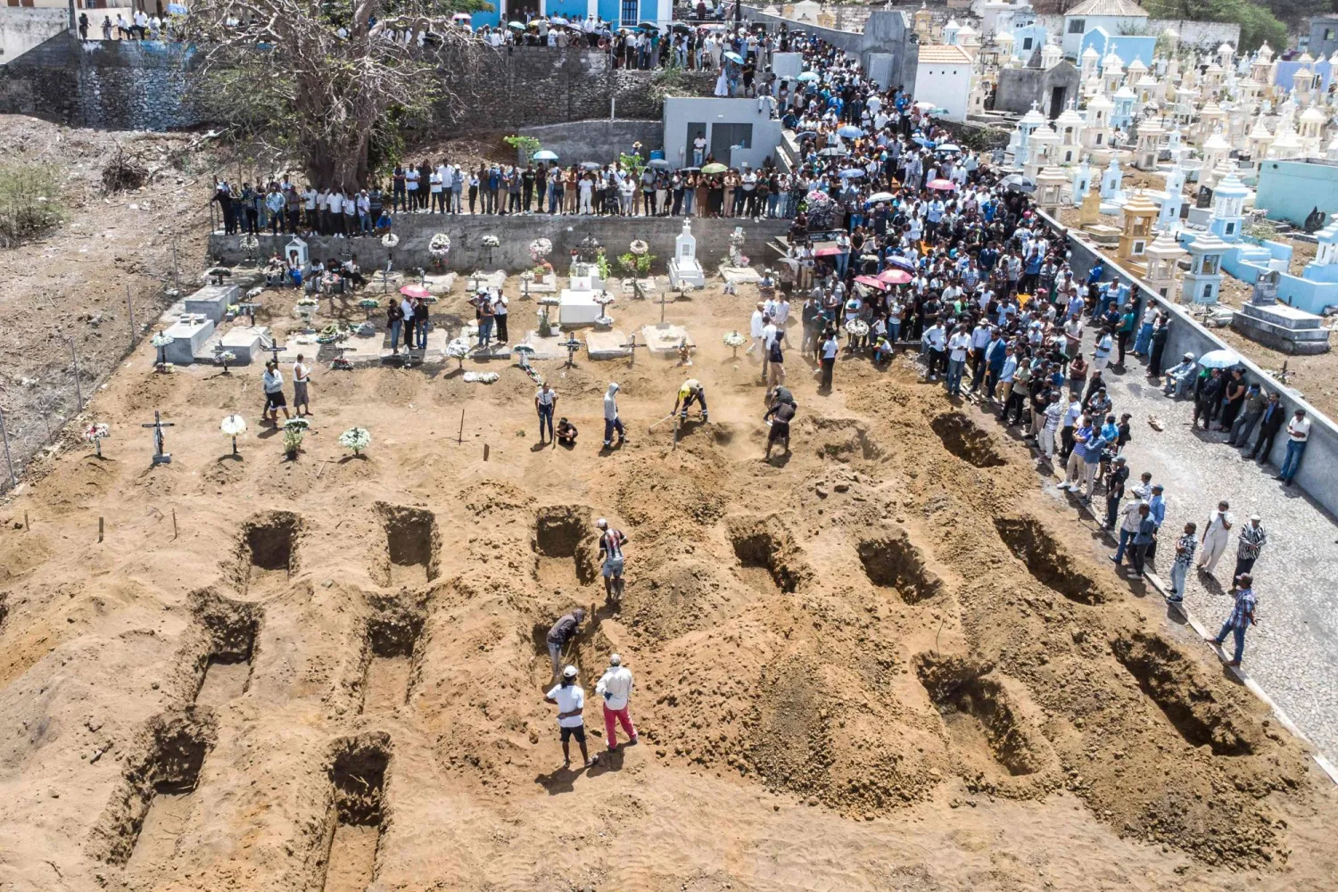 An aerial view of residents and relatives of the victims killed in a bus crash gathering during their funeral at Sao Lourenco Church in the town of Sao Lourenco, on the island of Fogo, on September 6, 2026. (Photo by Herculano da Luz / AFP)