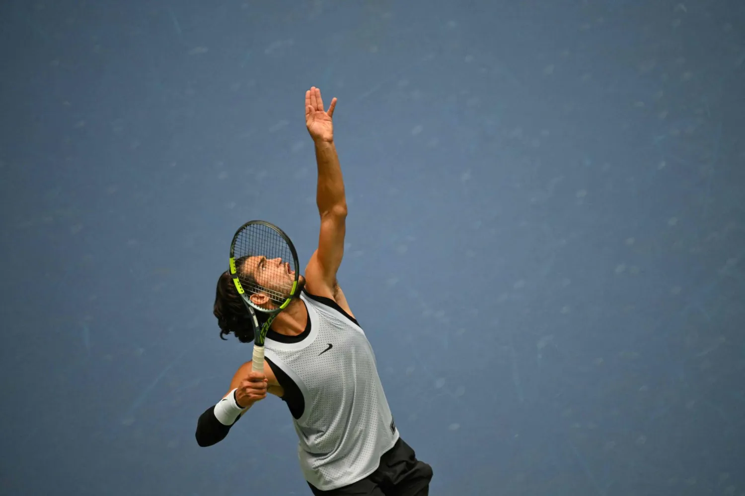 Spain's Carlos Alcaraz serves to USA's Tommy Paul during their men's singles round of 16 tennis match on day eight of the US Open tennis tournament at the USTA Billie Jean King National Tennis Center in New York on September 6, 2026. (AFP)