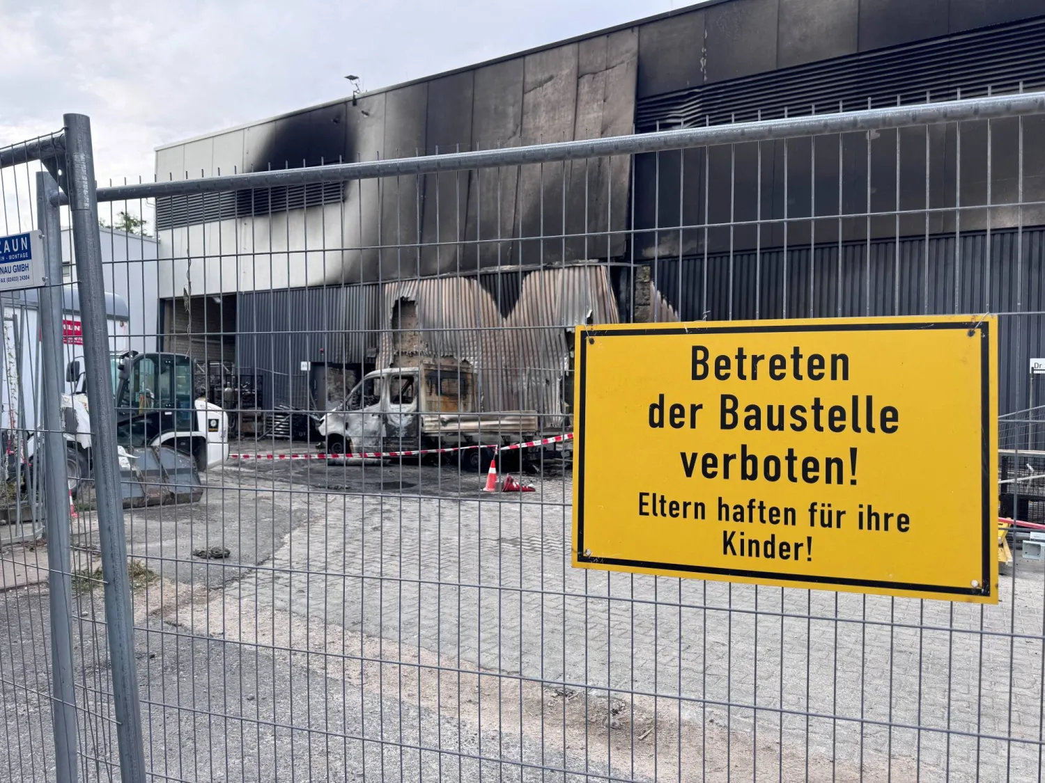 A burned vehicle sits at a construction site on the ground of a substation, as police is investigating a fire at the transformer substation, further raising security concerns over a series of sabotage attacks on Germany's power grid, in Berlin, Germany, September 7, 2026. Sign reads "No entry to the construction site". (Reuters) 