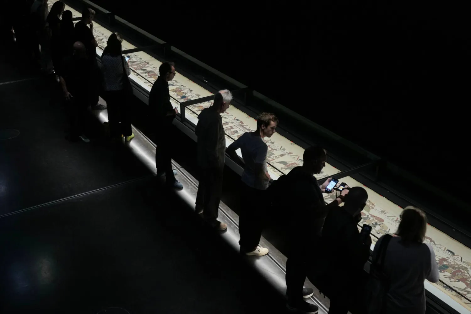  The 70-meter-long Bayeux Tapestry is displayed during a press preview at the British Museum in London after returning to England, following a historic agreement between the UK and France, Monday, Sept. 7, 2026. (AP) 