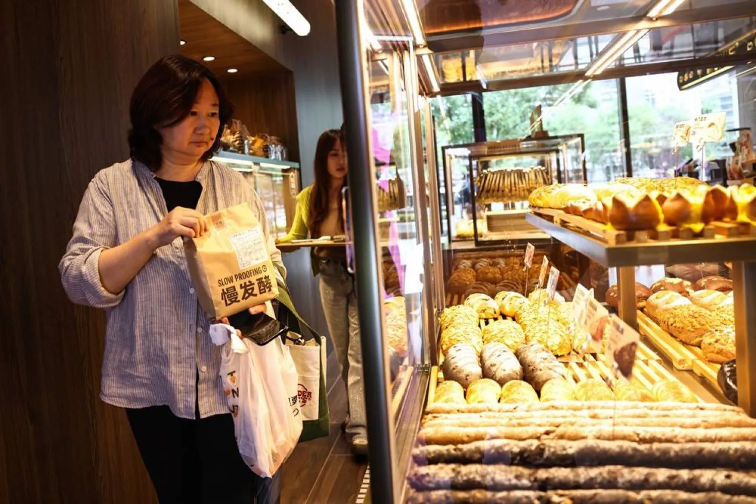 People shop in a bakery in a shopping mall in Beijing, China, 08 September 2026. (EPA)