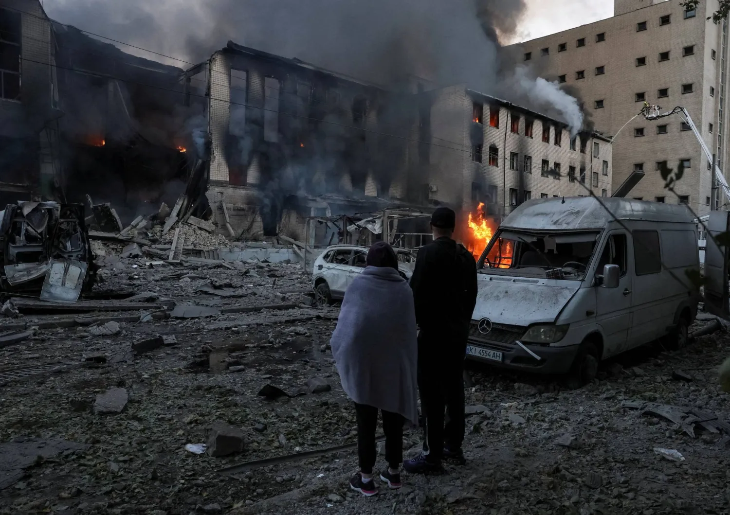 Residents stand at a site of a Russian missile attack, amid Russia's attack on Ukraine, in Kyiv, Ukraine September 8, 2026. (Reuters)