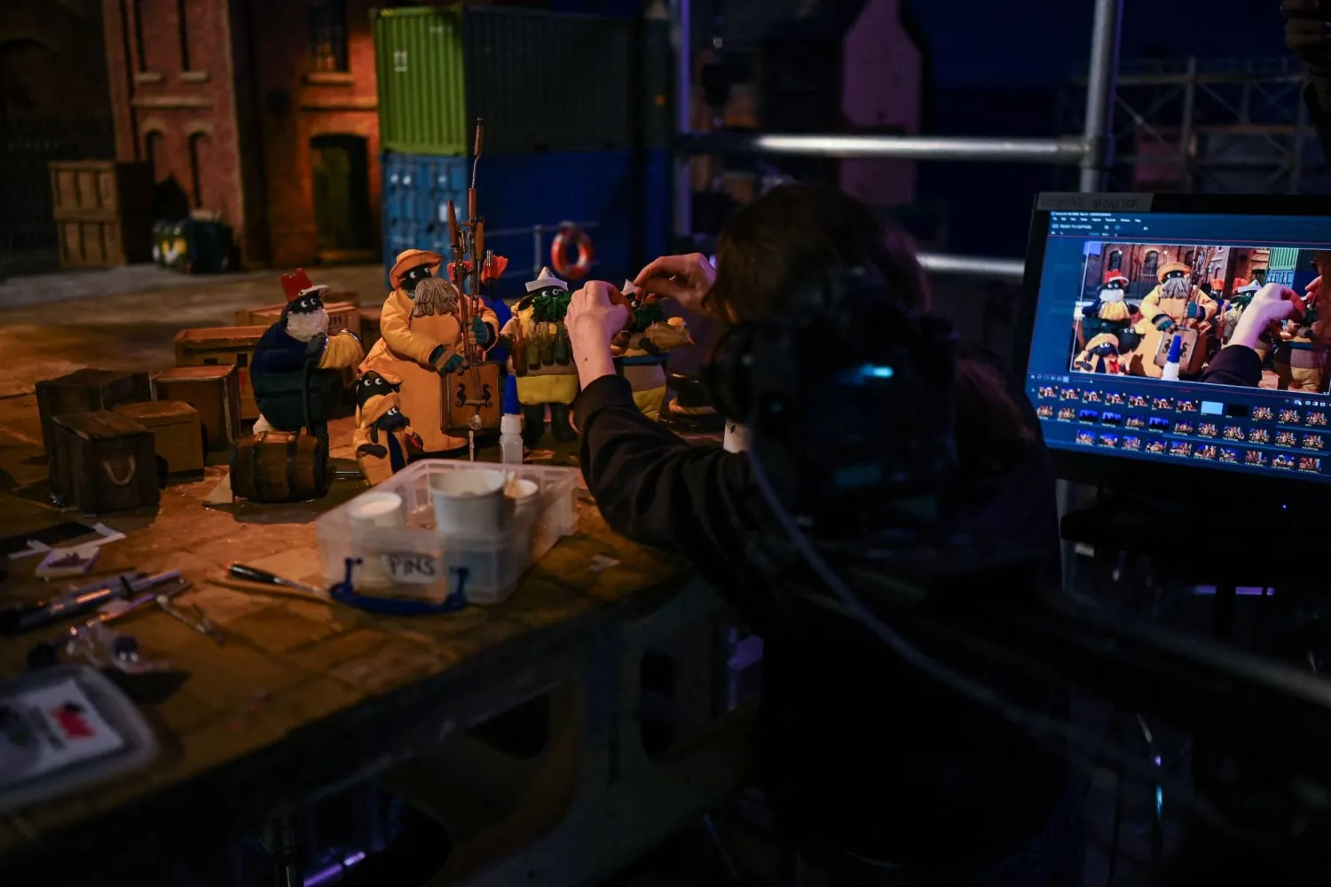 This photo taken on March 4, 2026 shows an employee working on models for "Shaun the Sheep: The Beast of Mossy Bottom" at Aardman Animations studios in Bristol, western England. (AFP)