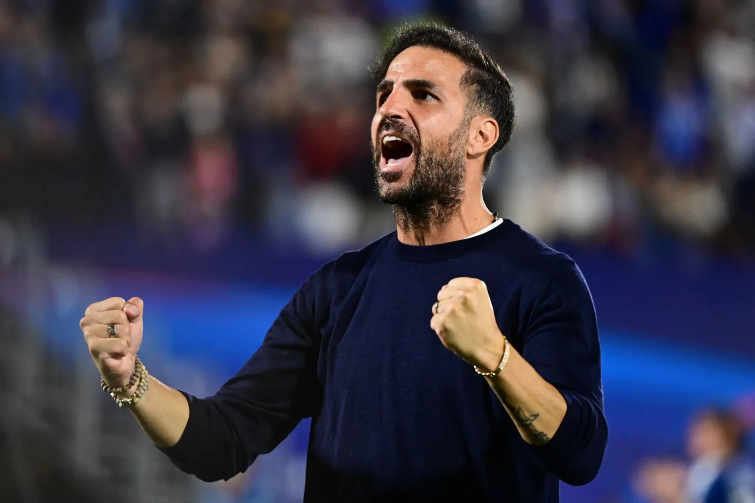 Como's Spanish coach Cesc Fabregas celebrates the victory of his team at the end of the UEFA Champions League, league phase, matchday 1, football match between Como 1907 and RB Leipzig at the Giuseppe Sinigaglia stadium in Como, on September 10, 2026. (Photo by PIERO CRUCIATTI / AFP)