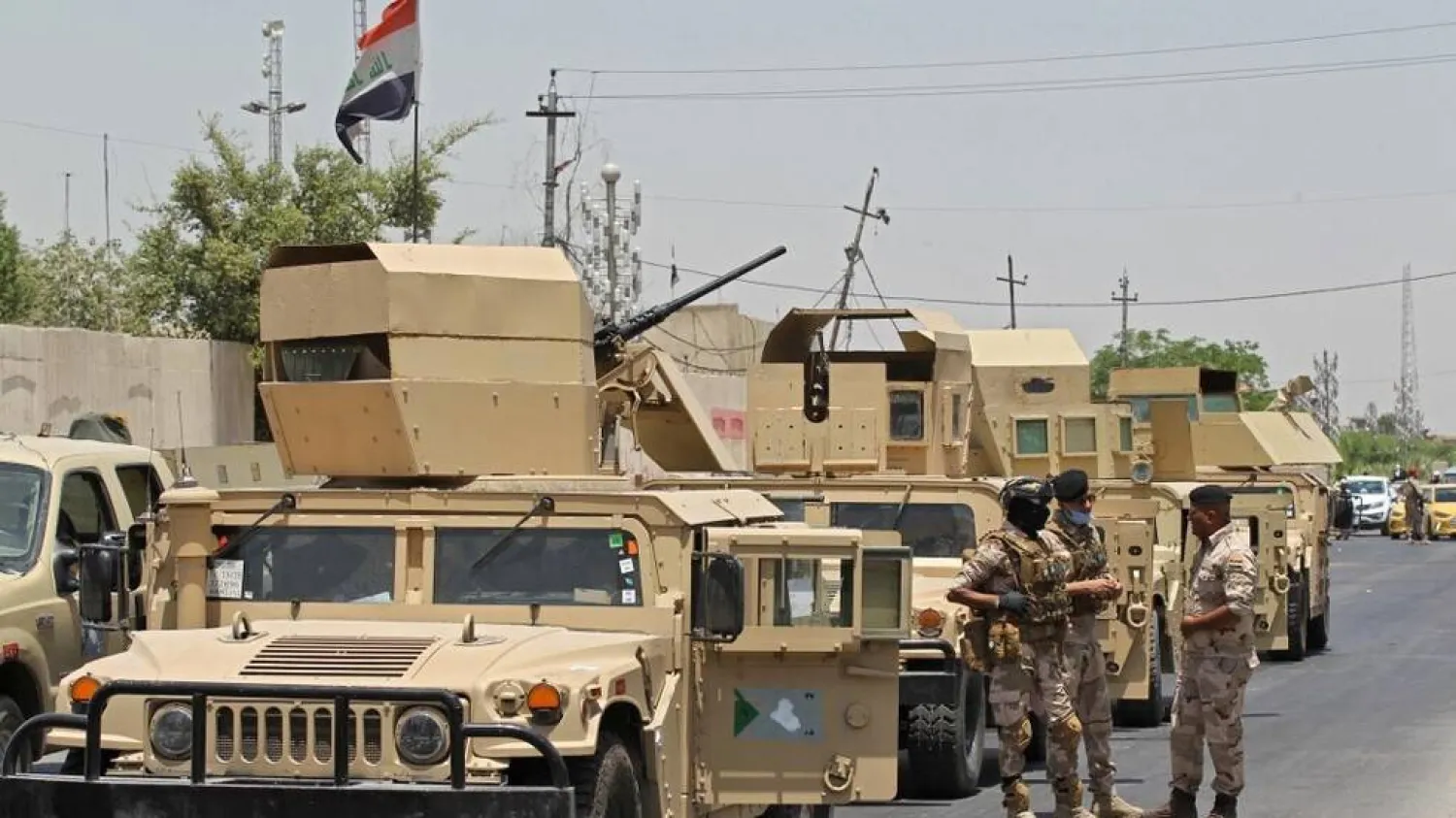 Vehicles of the Iraqi army at the entrance to the capital Baghdad’s suburb of Sadr City. (AFP file)