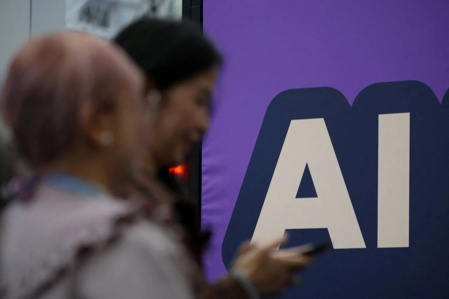 A banner shows message reading "AI" during the London Tech Week at Olympia, in London, Britain, June 8, 2026. (Reuters)