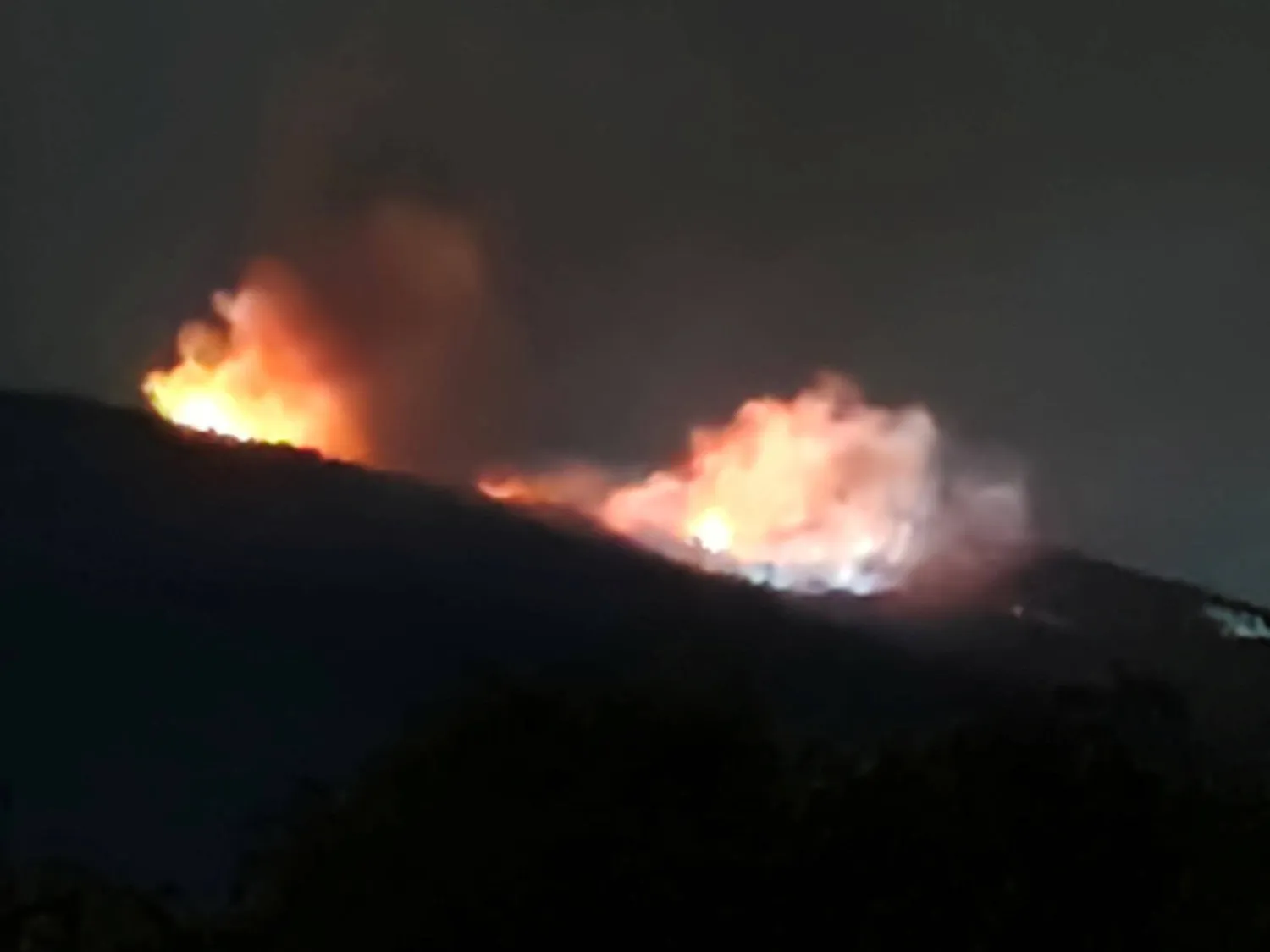 Fire and smoke rise near an ammunition warehouse, near the village of Tsareva Livada, Bulgaria, September 12, 2026. Stringer/via REUTERS 
