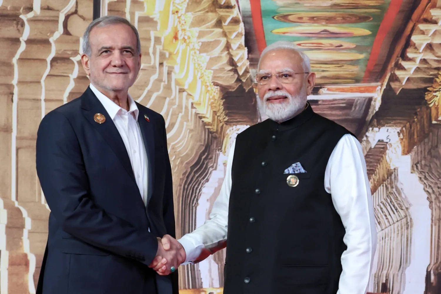 Indian Prime Minister Narendra Modi, right, greets Iranian President Masoud Pezeshkian upon his arrival for the BRICS summit in New Delhi, India, Saturday, Sept. 12, 2026. (Indian Foreign Ministry via AP)