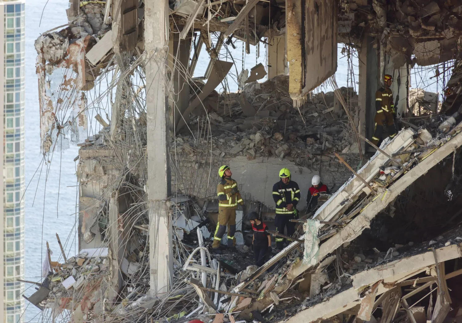 Ukrainian rescuers work amid the rubble at the site of a Russian strike on a multi-story residential building in Odesa, southern Ukraine, 12 September 2026, amid the ongoing Russian invasion. EPA/IGOR MASLOV