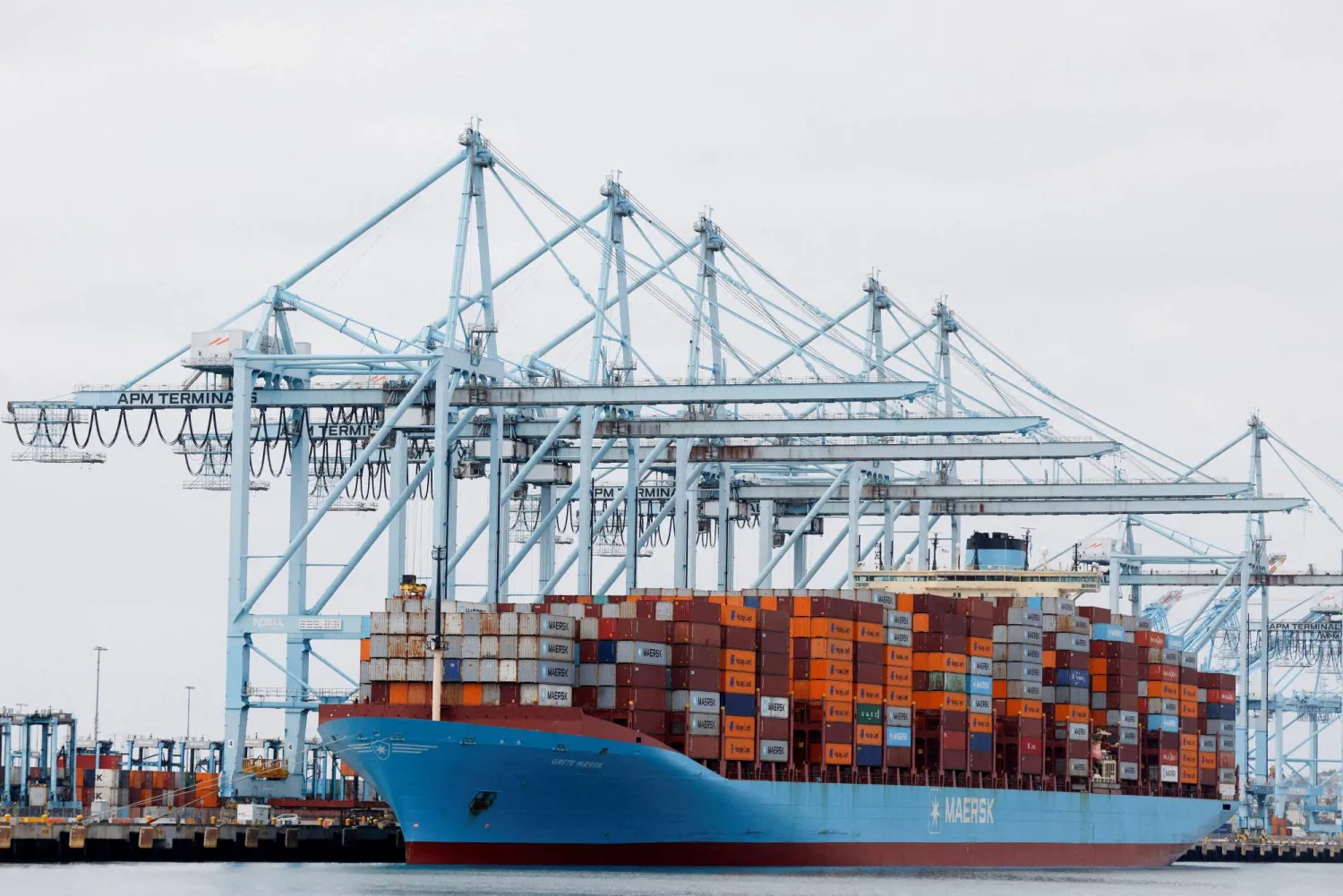 FILE PHOTO: Shipping containers sit on a Maersk vessel docked at the port of Los Angeles in Long Beach, California, US, March 10, 2026. REUTERS/Caroline Brehman/File Photo