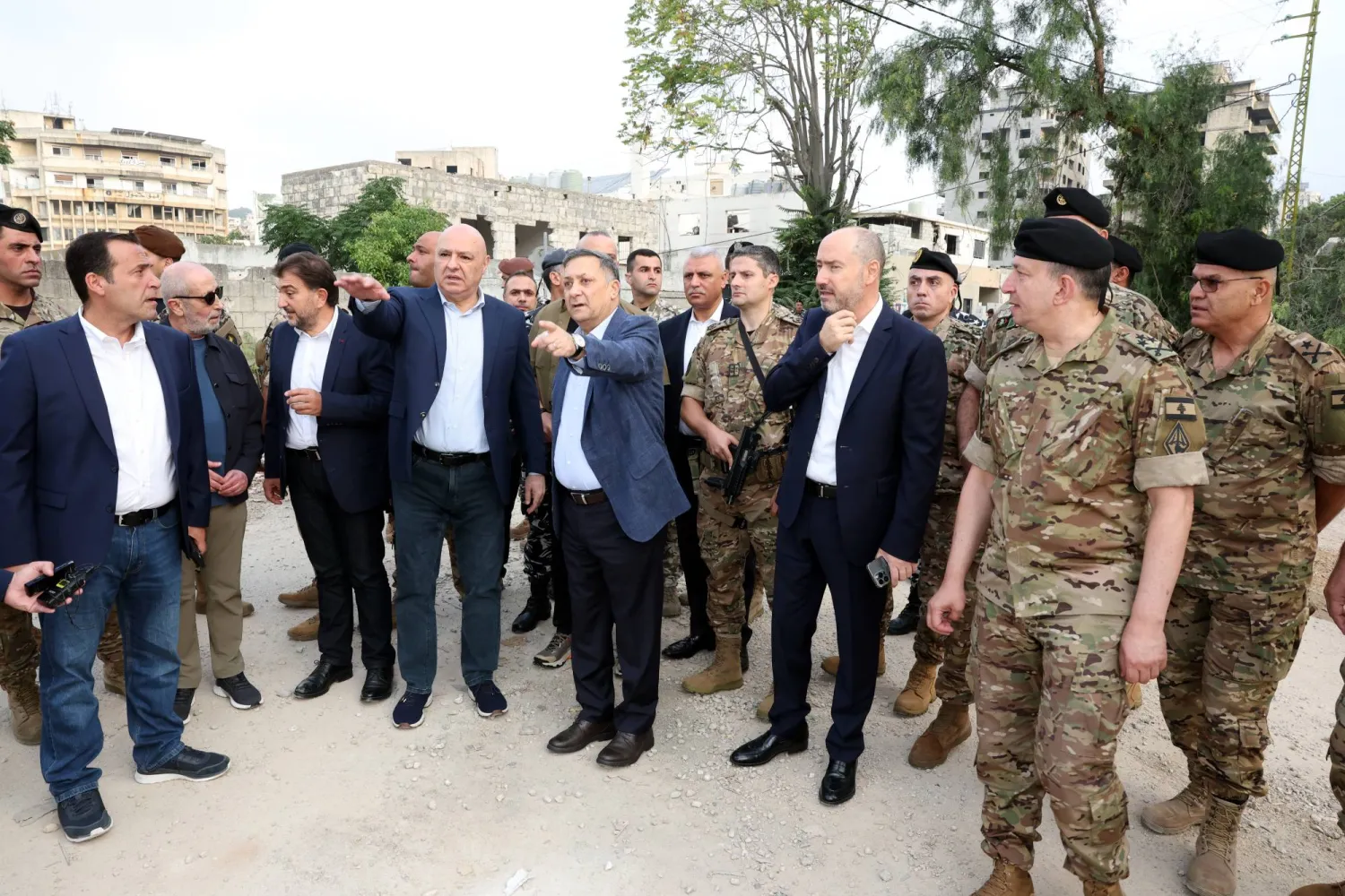 Lebanese President Joseph Aoun and an accompanying delegation tour the southern city of Nabatieh on Saturday (EPA)
