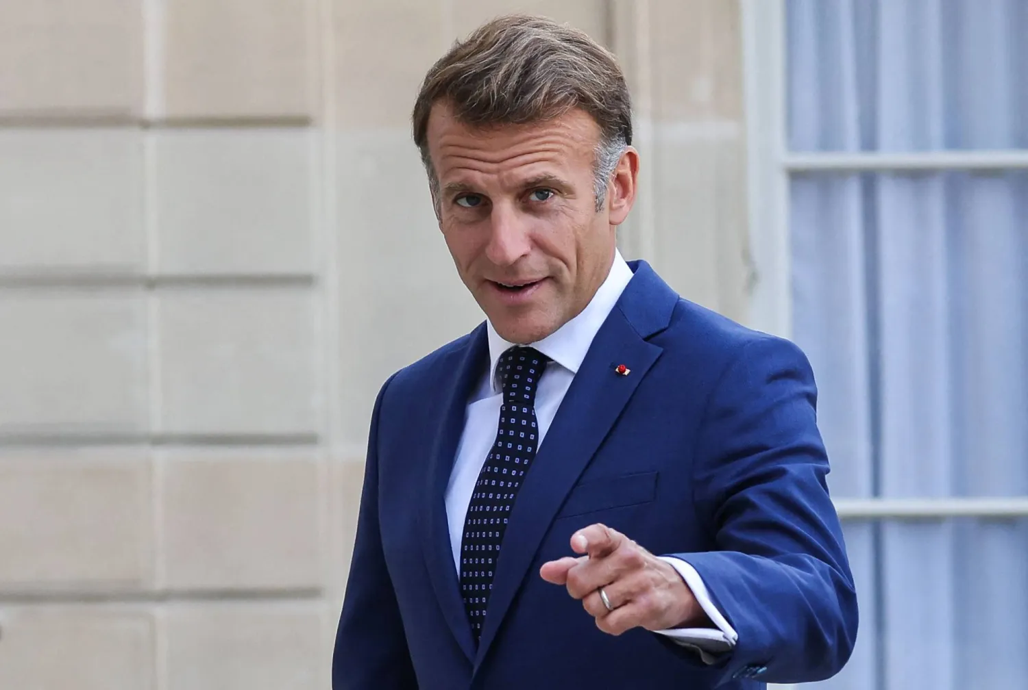  French President Emmanuel Macron gestures as he welcomes Vietnam's President and his wife at the Elysee Palace in Paris on September 10, 2026. (AFP) 