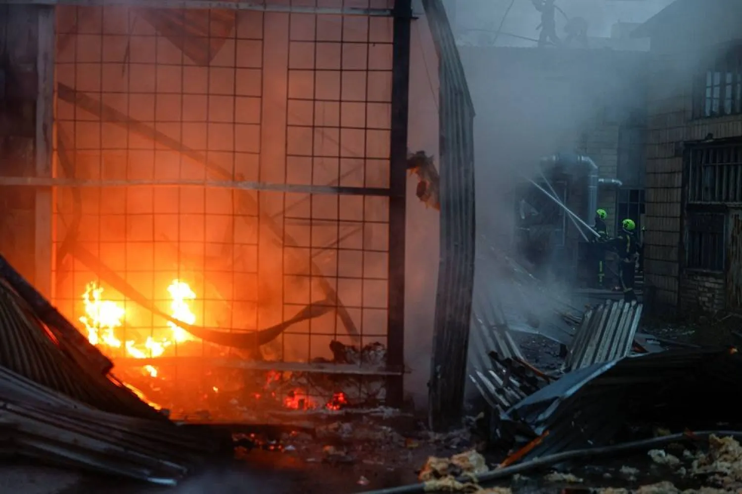  Firefighters work at the site of a non-residential building hit by a Russian drone strike, amid Russia's attack on Ukraine, in Kyiv, Ukraine, September 11, 2026. (Reuters)